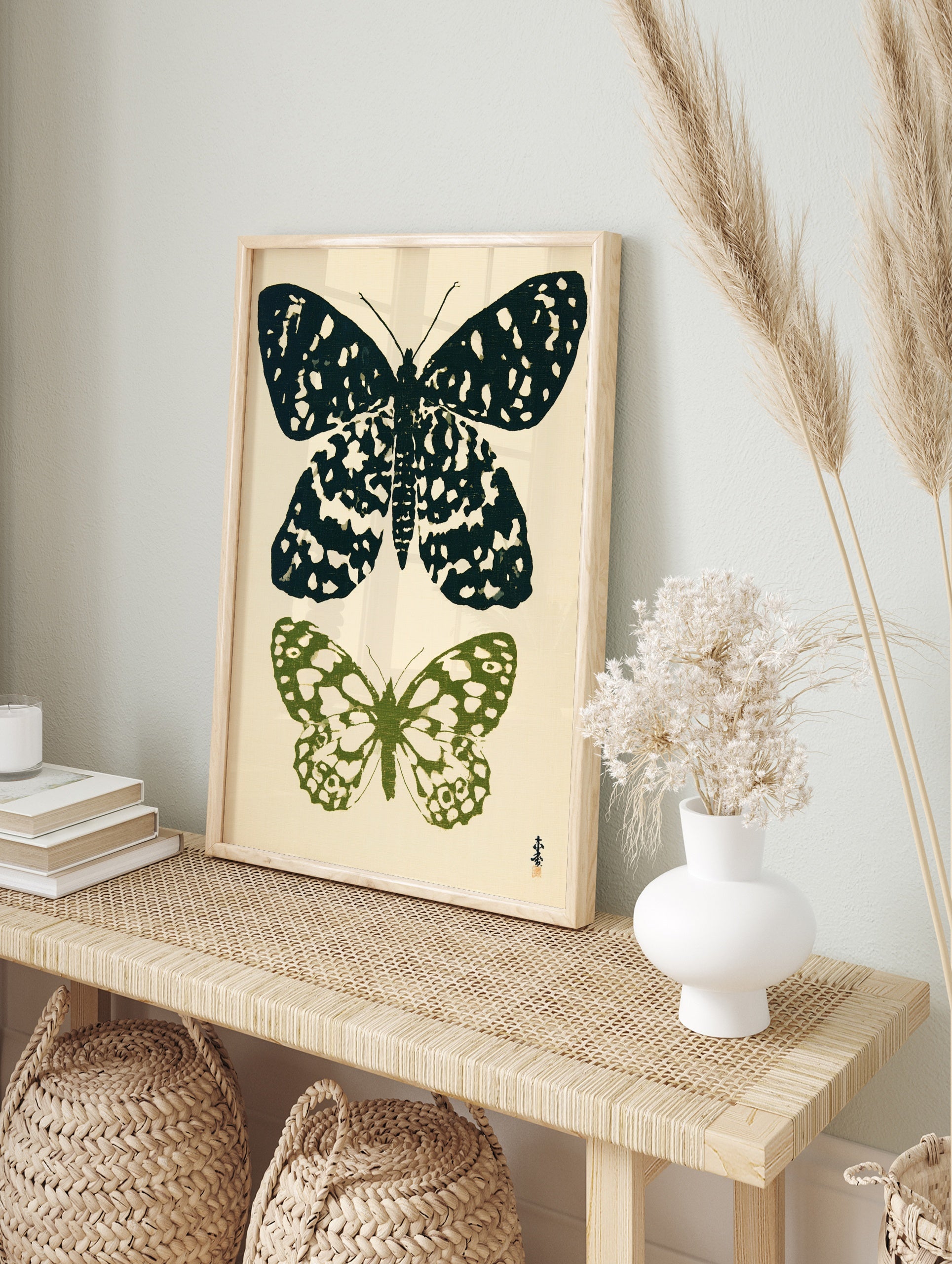 Botanical butterfly illustration art print with one black and one green butterfly on a light, in an alternate framed mockup