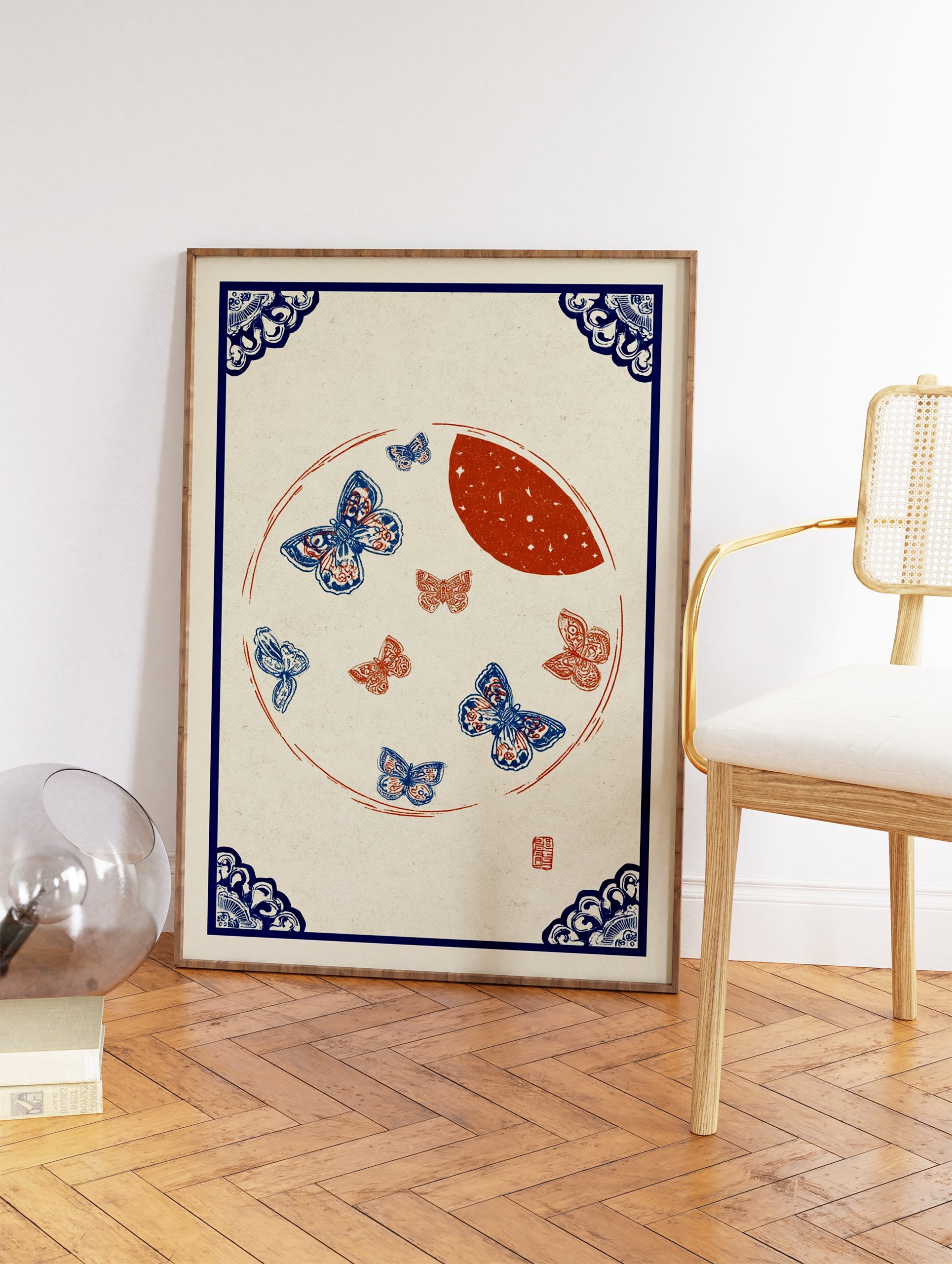 Traditional blue and red butterfly wall art print with a moon and ornate blue corner borders on a light background. - Image 2
