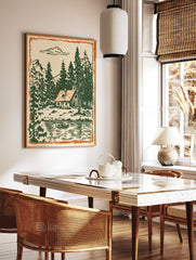 Vintage illustration of a cabin by a lake with green pine trees, mountains, and an orange border. - Image 3