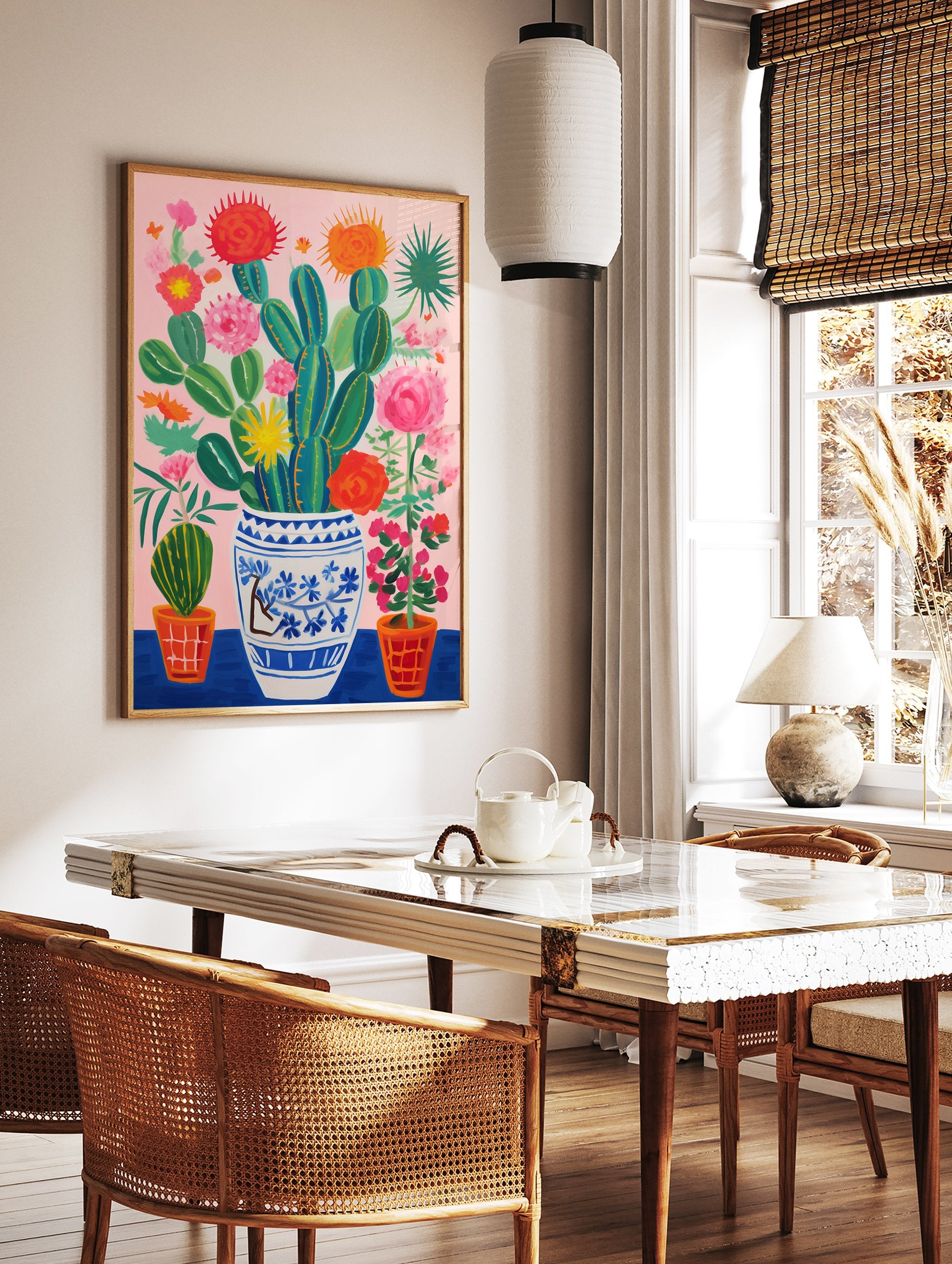 Vibrant cactus and flowers poster in a blue and white vase with pink background and orange pots. - Image 2