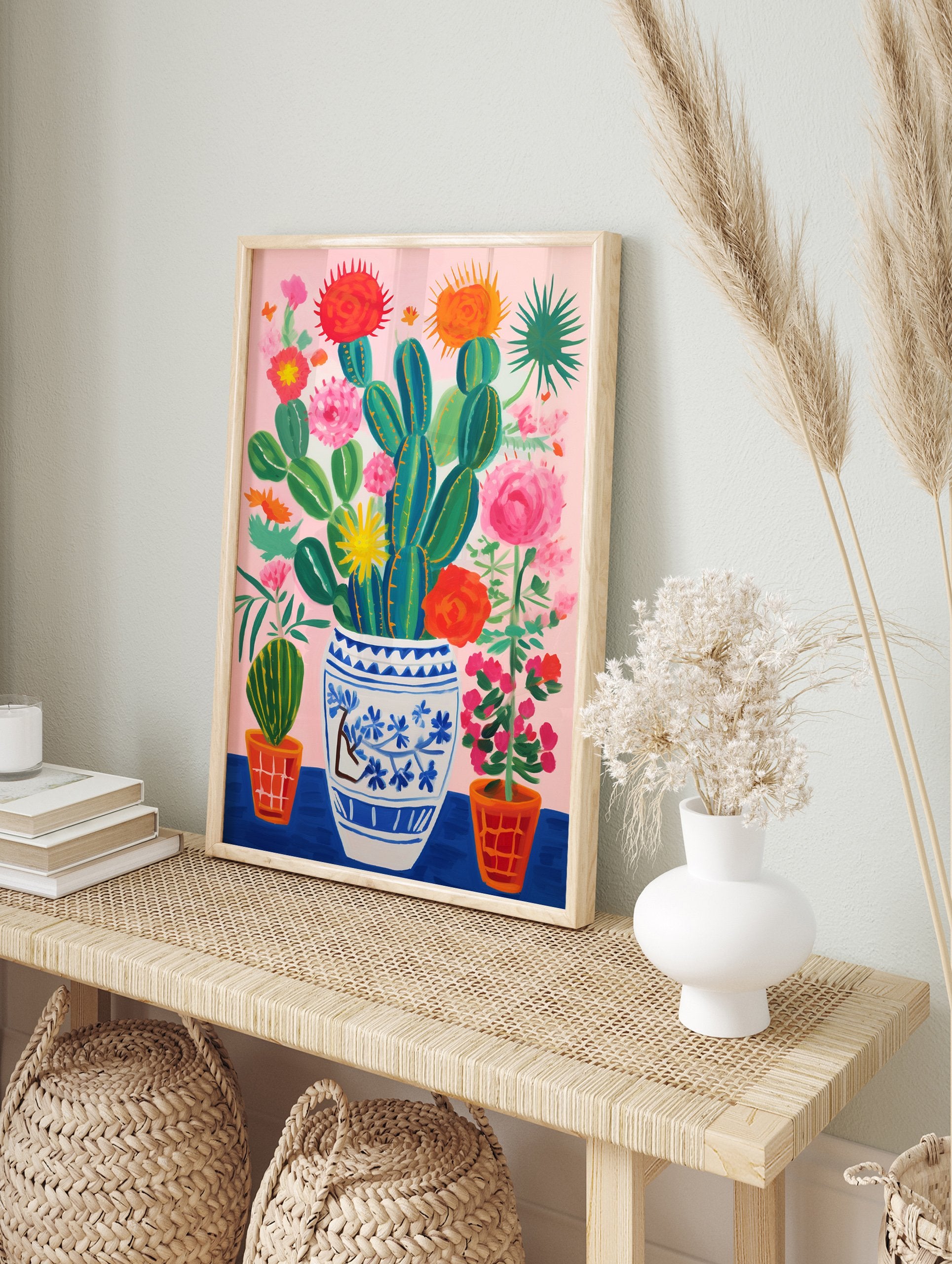 Vibrant cactus and flowers poster in a blue and white vase with pink background and orange pots. - Image 4