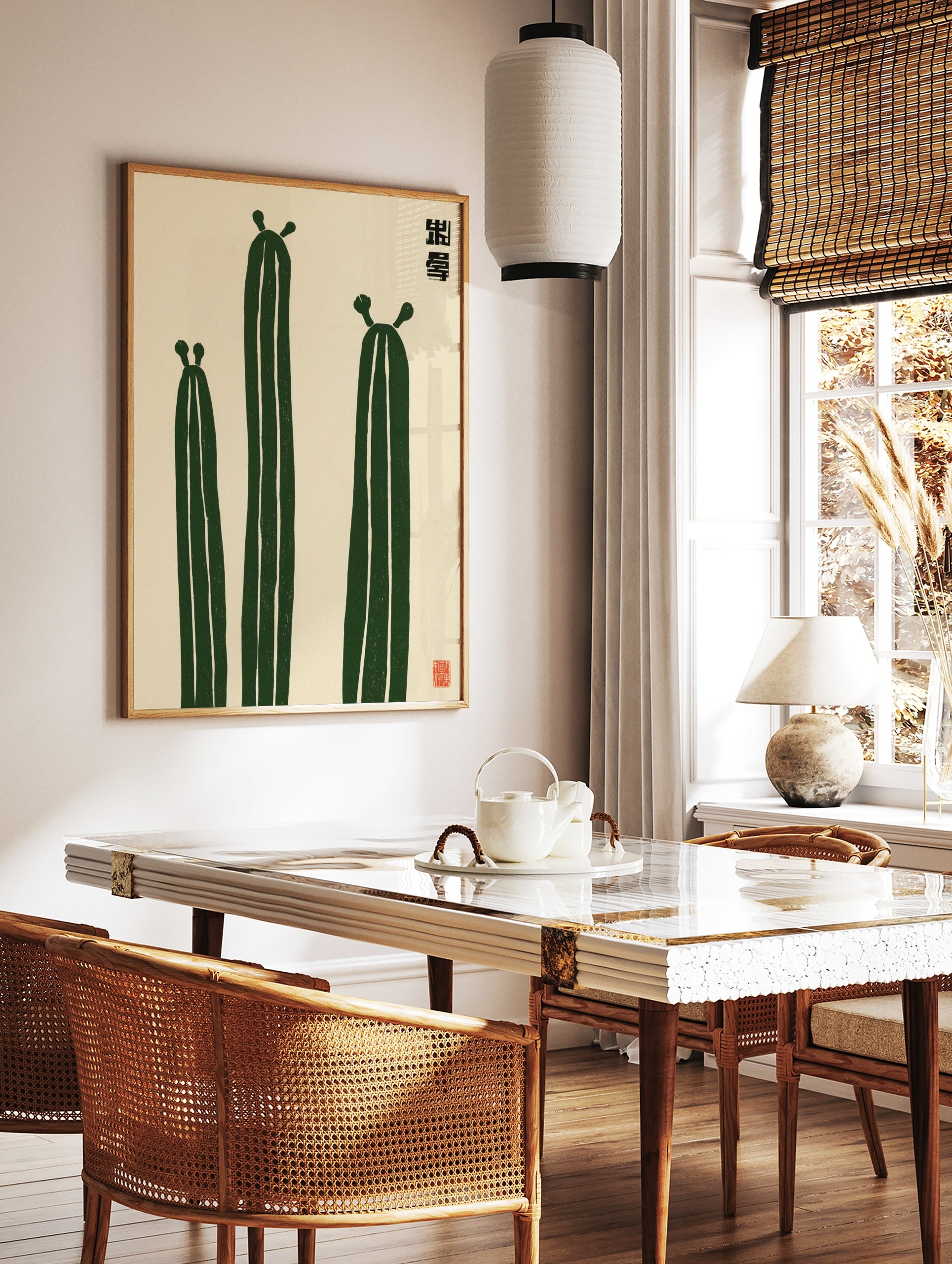 Minimalist illustration of three green cactus plants with Japanese-style text and a red seal on a, in a styled room mockup