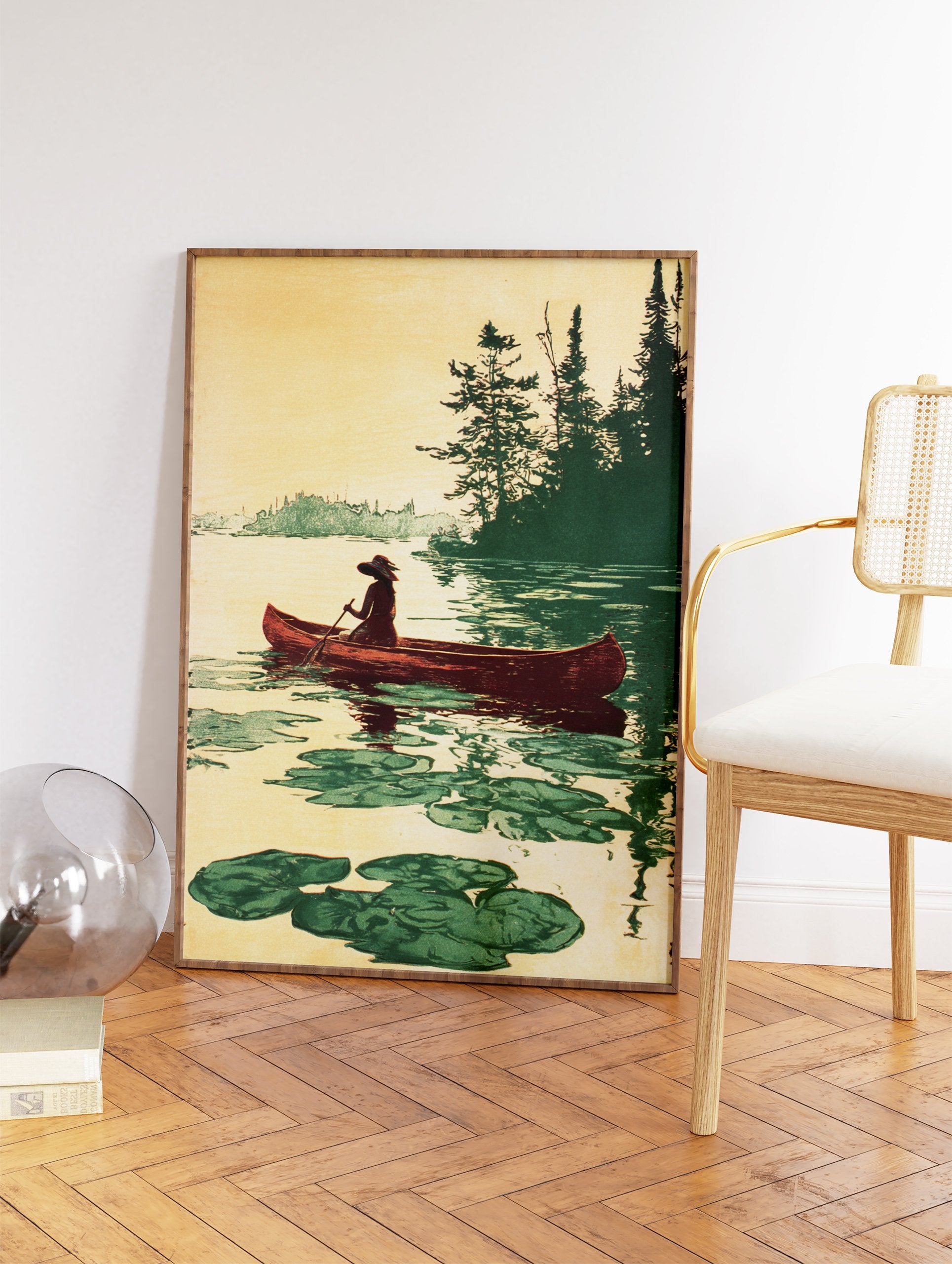 Vintage illustration of a person canoeing on a calm lake with lily pads and pine trees in a warm, earthy palette. - Image 2