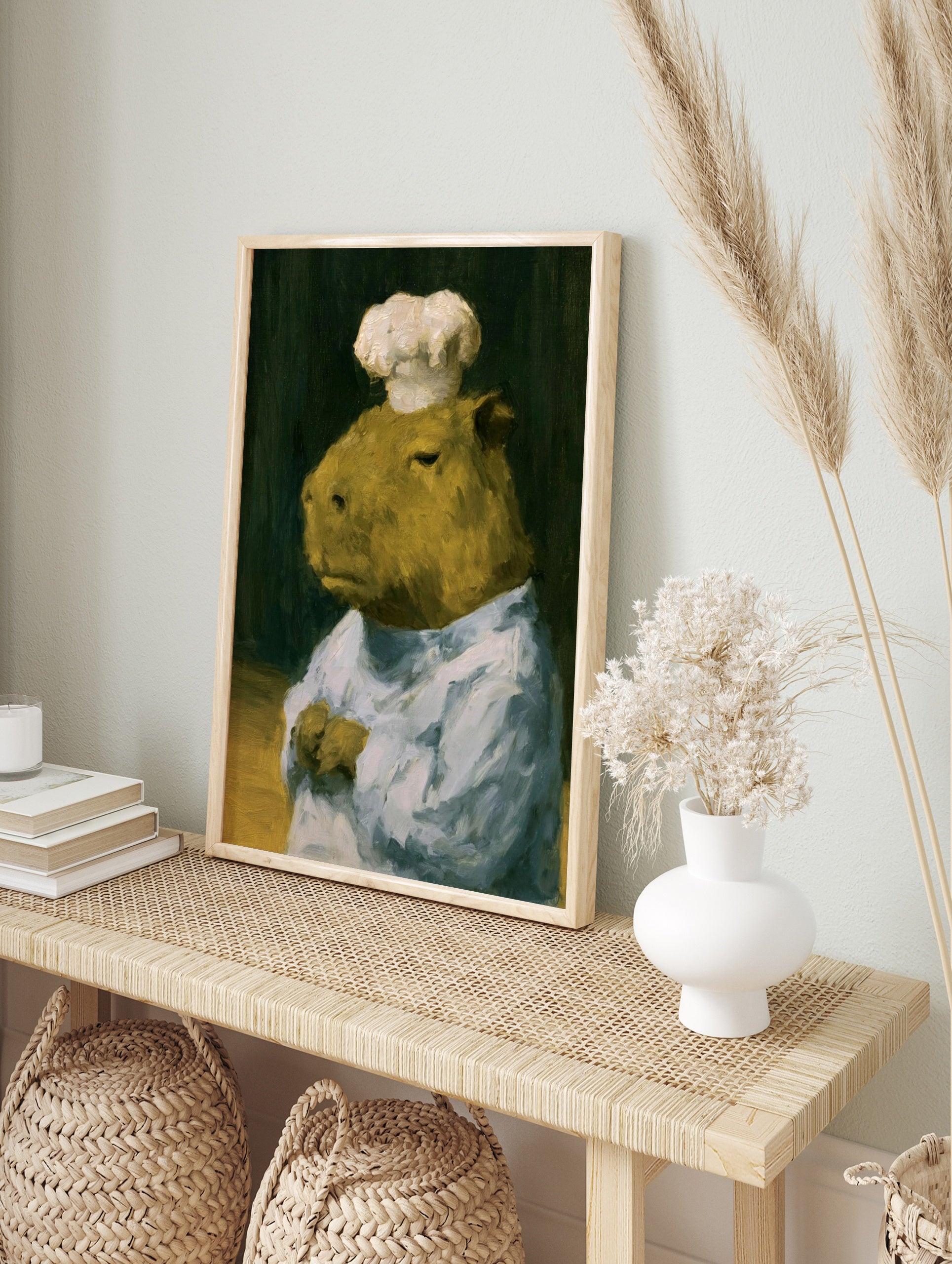 Painterly oil art print of a capybara wearing a white chef hat against a dark background, in an alternate framed mockup