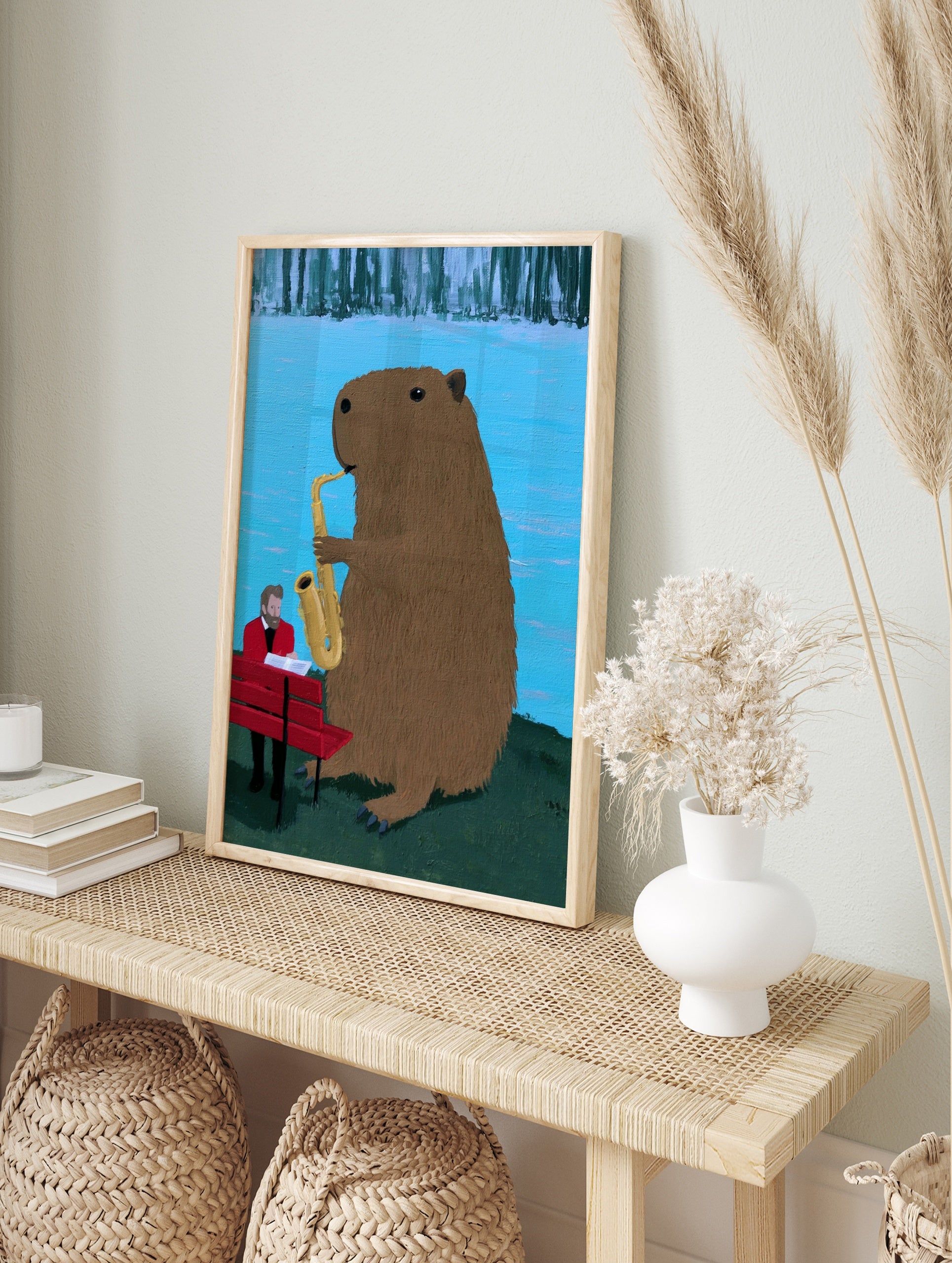 Capybara playing a saxophone next to a man in a red suit on a bench, illustrative art print, in an alternate framed mockup