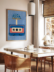 Retro illustration of an audio cassette tape with a blue spotted mushroom growing from it, set, in a styled room mockup