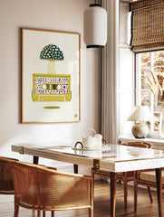 Retro cassette tape illustration with a large patterned mushroom cap growing out of it, yellow and, in a styled room mockup