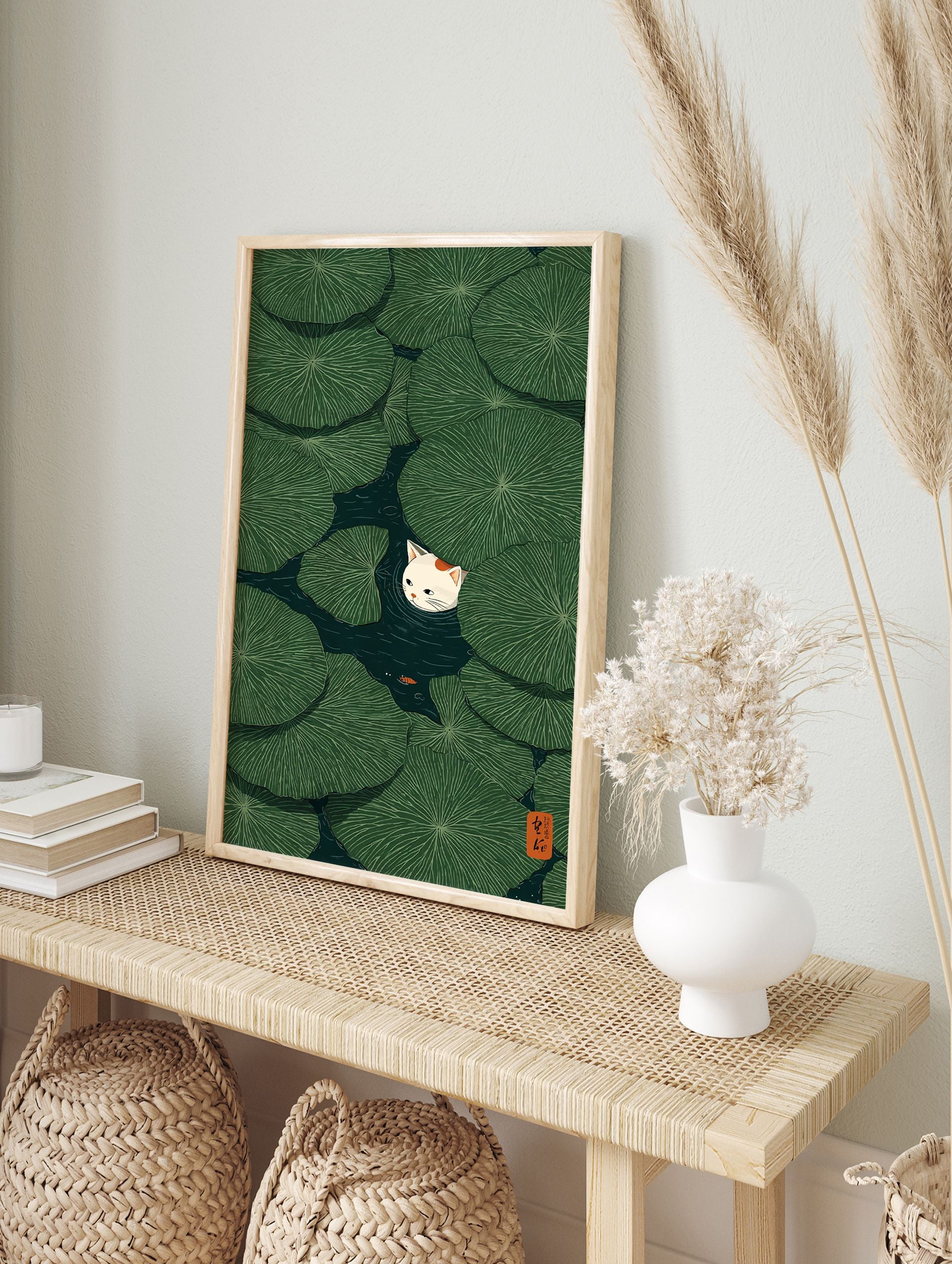 Cat & Lily Pad Poster featuring a white cat peeking from green lily pads in a dark pond with a small orange fish. - Image 4