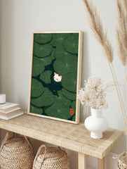 Cat & Lily Pad Poster featuring a white cat peeking from green lily pads in a dark pond with a small orange fish. - Image 4