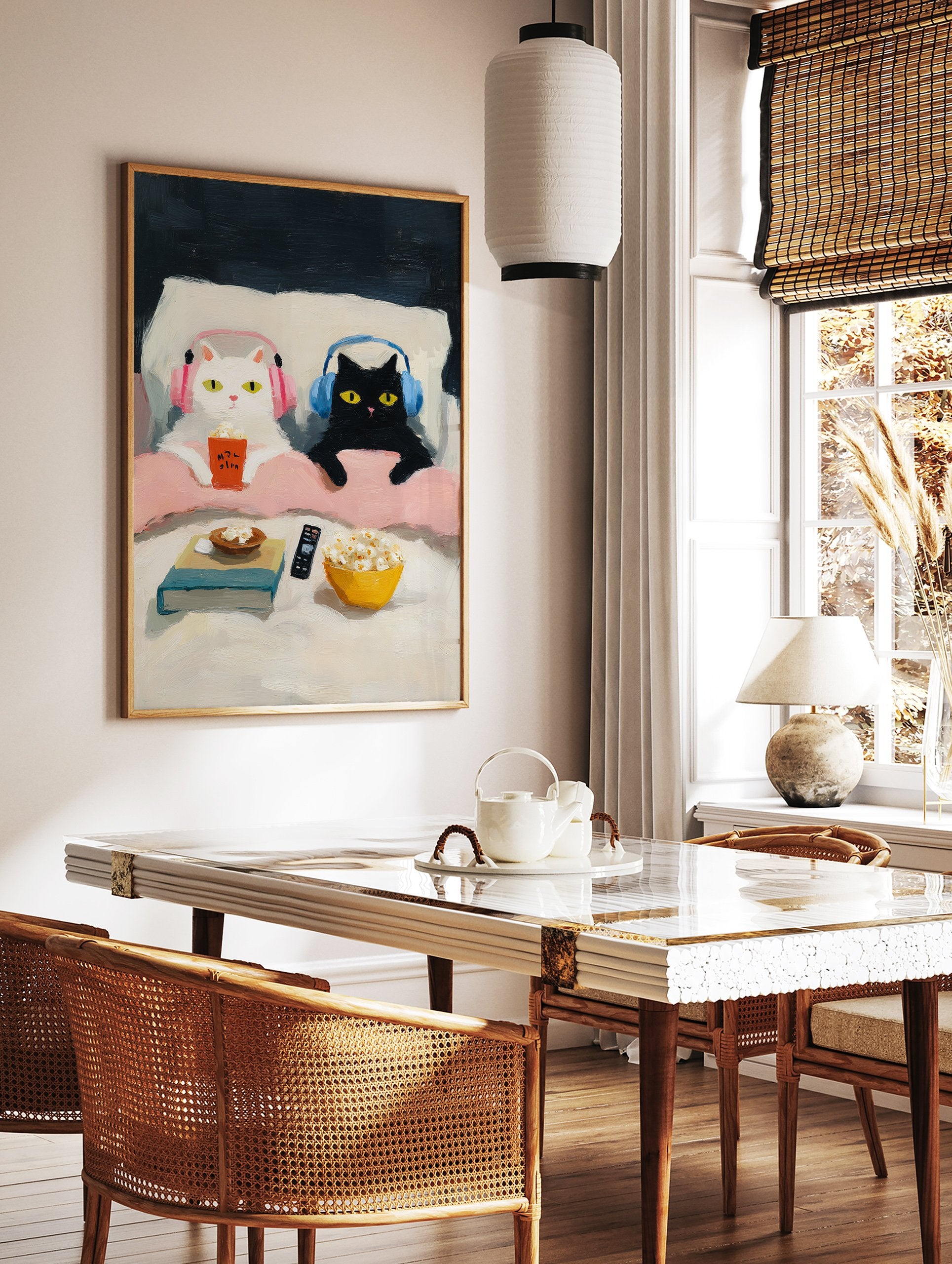 Whimsical cat art print of a white cat and a black cat with headphones enjoying popcorn in bed during a movie night. - Image 2