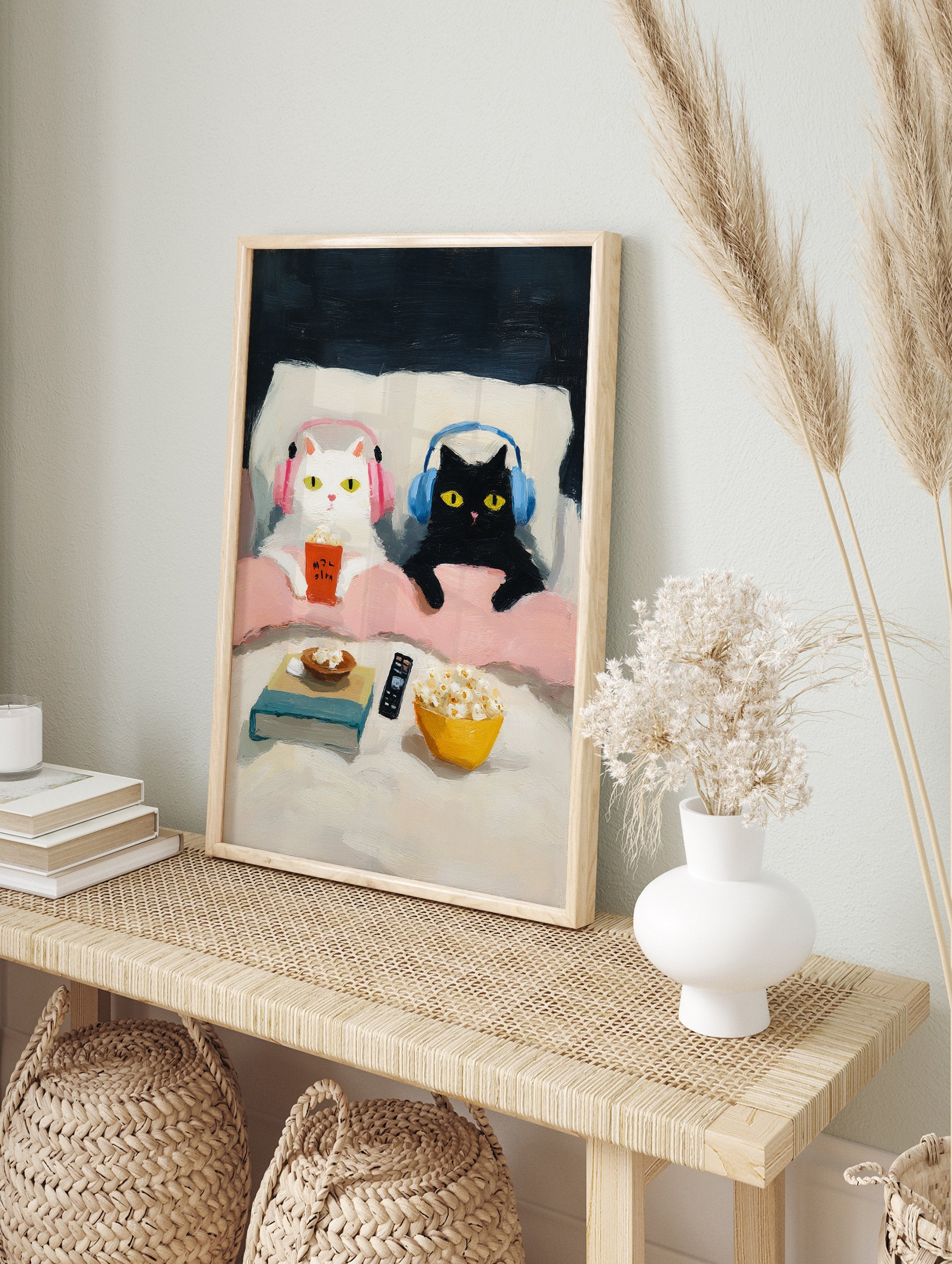 Whimsical cat art print of a white cat and a black cat with headphones enjoying popcorn in bed during a movie night. - Image 3