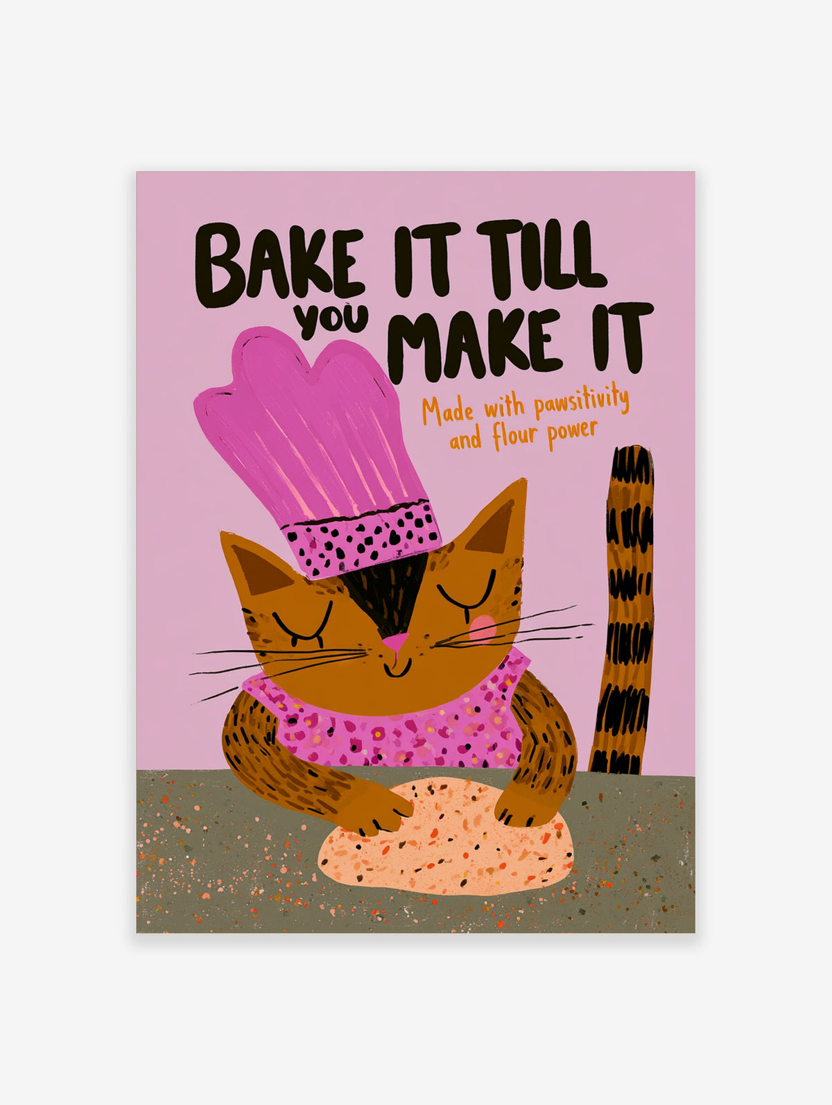 Brown tabby cat in pink chef hat kneading dough, with text Bake It Till You Make It on pink background