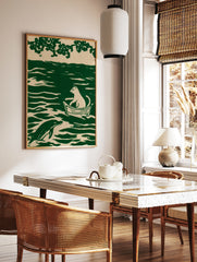 Illustration of a cat sitting in a boat on wavy water with a dolphin, printed in green and off-white, in a styled room mockup