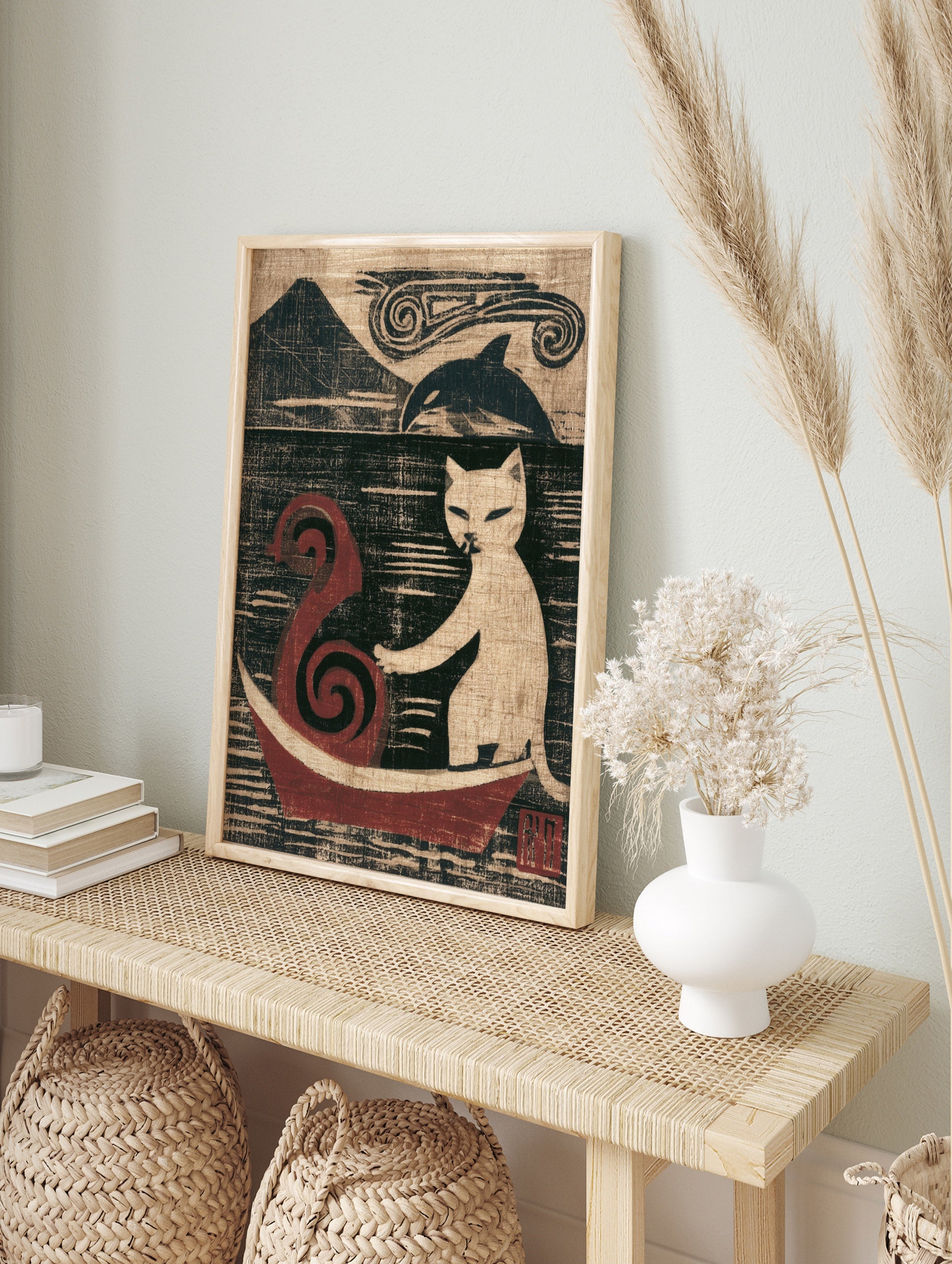 Stylised art print of a white cat in a red boat with a mountain and orca in the background, in an alternate framed mockup