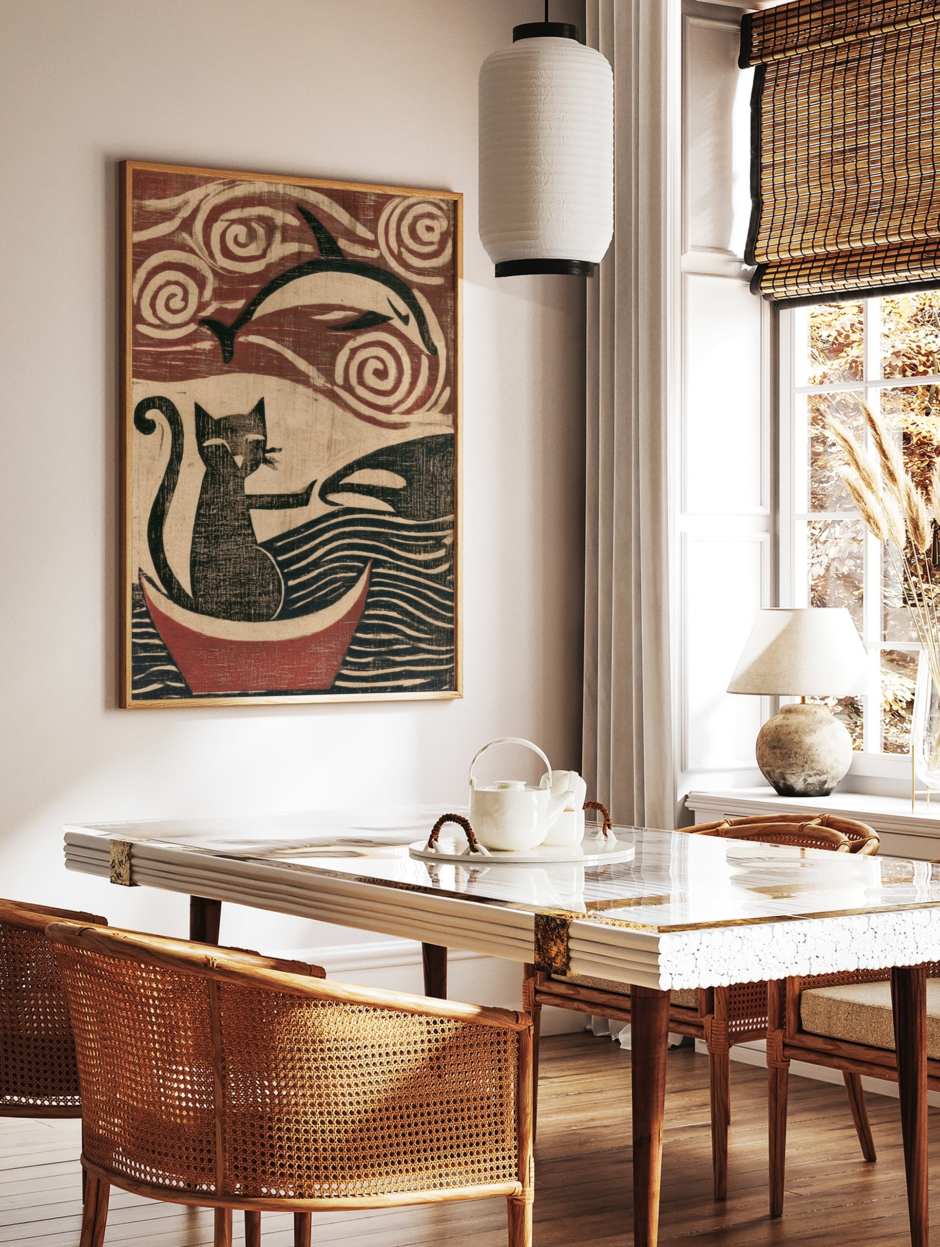 Woodblock style art print of a cat in a boat reaching for a dolphin with swirling sky and wave, in a styled room mockup