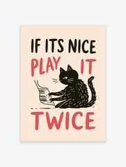 Illustrative wall art of a black cat playing the piano with red text reading IF ITS NICE PLAY IT TWICE on cream background