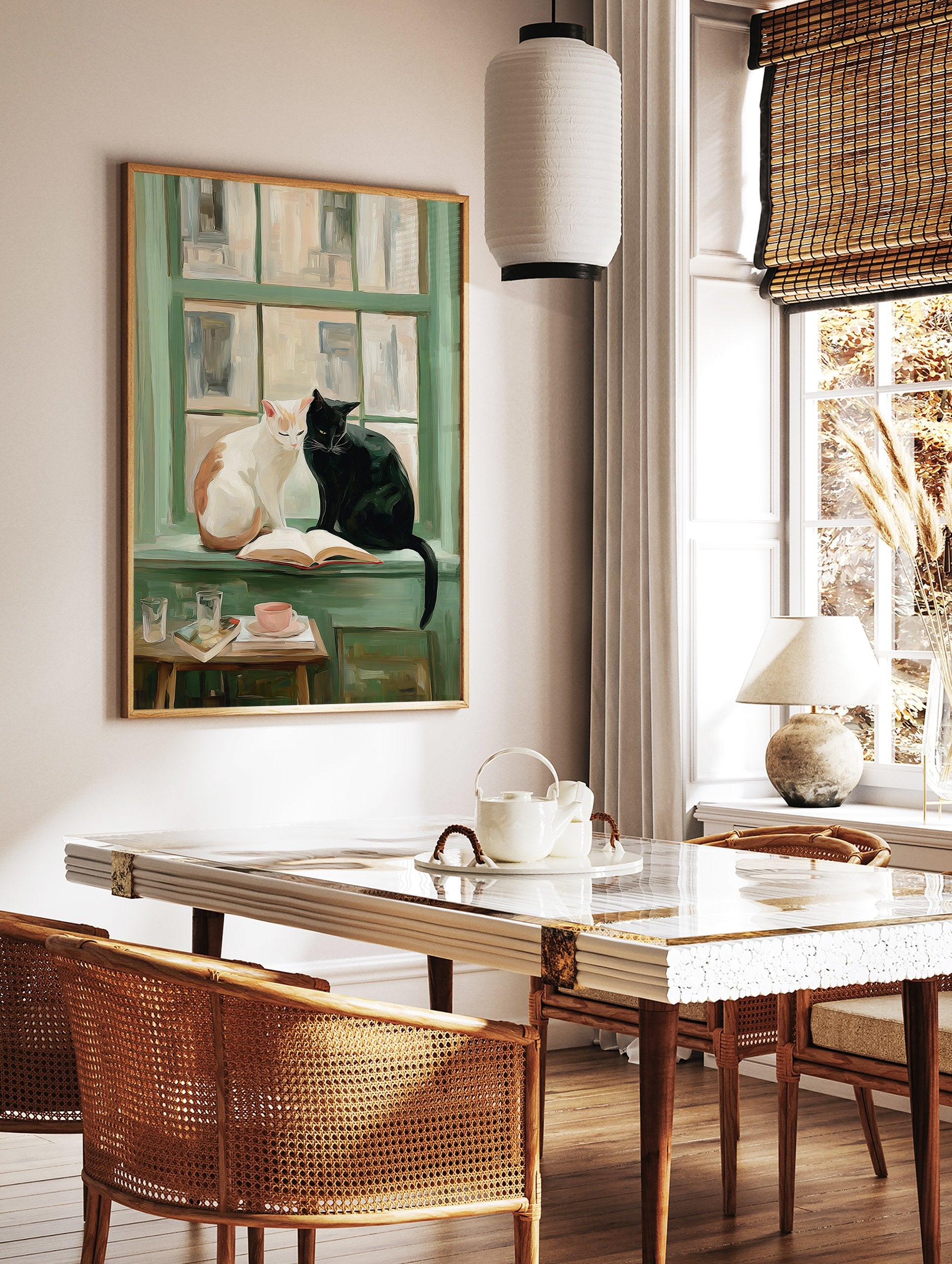 Painterly art print showing a white and a black cat sitting on a green windowsill with an open book, teacup, and glasses. - Image 2