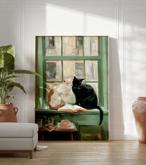 Painterly art print showing a white and a black cat sitting on a green windowsill with an open book, teacup, and glasses. - Image 3