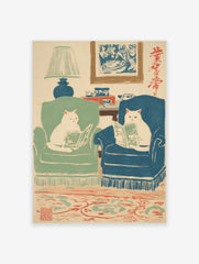 Illustrated art print featuring two white cats in armchairs reading books in a cozy living room with a lamp and rug.