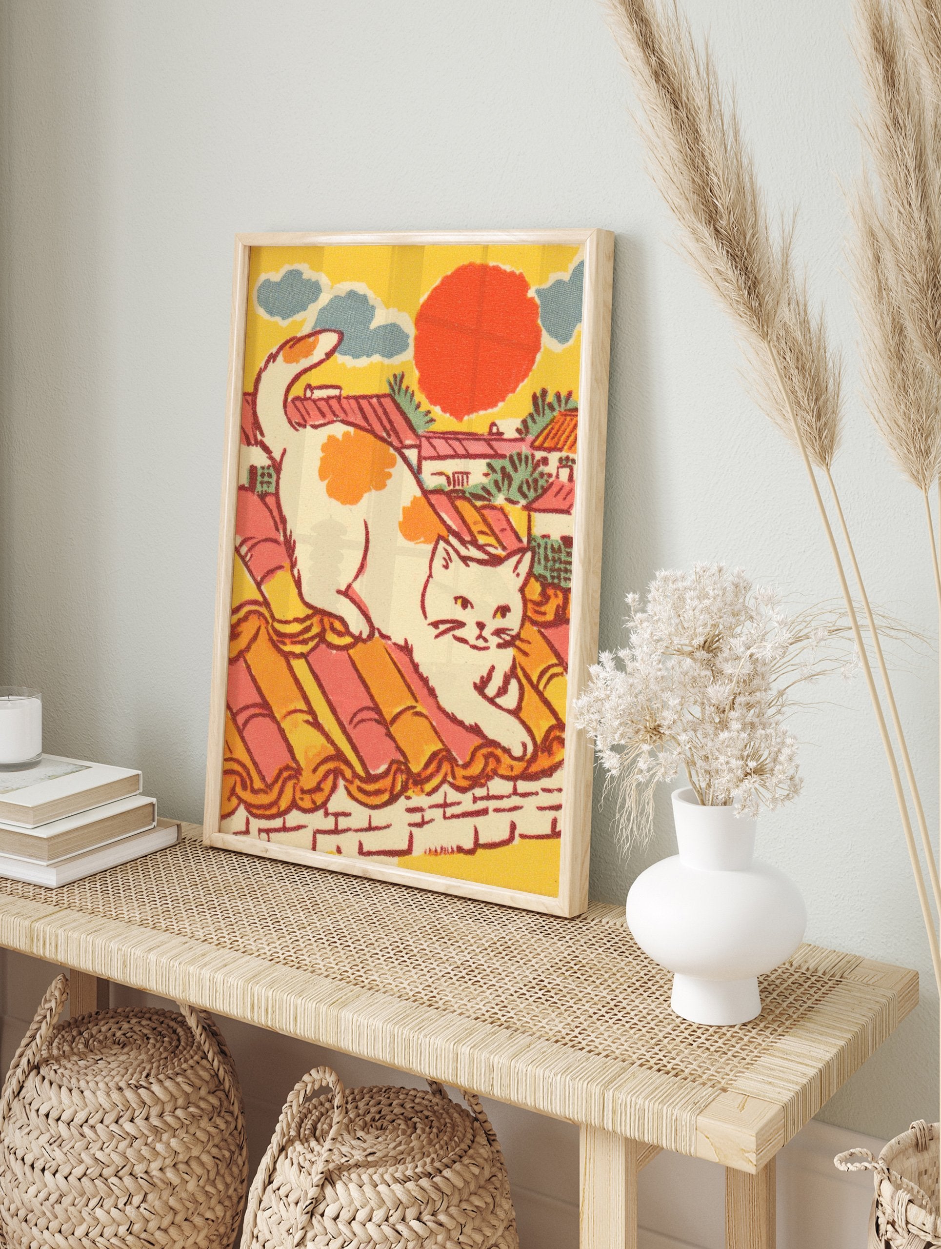 Vintage style illustration of a white cat with orange spots stretching on a terracotta tiled rooftop under a red sun, blue clouds. Cat Wall Art. - Image 3