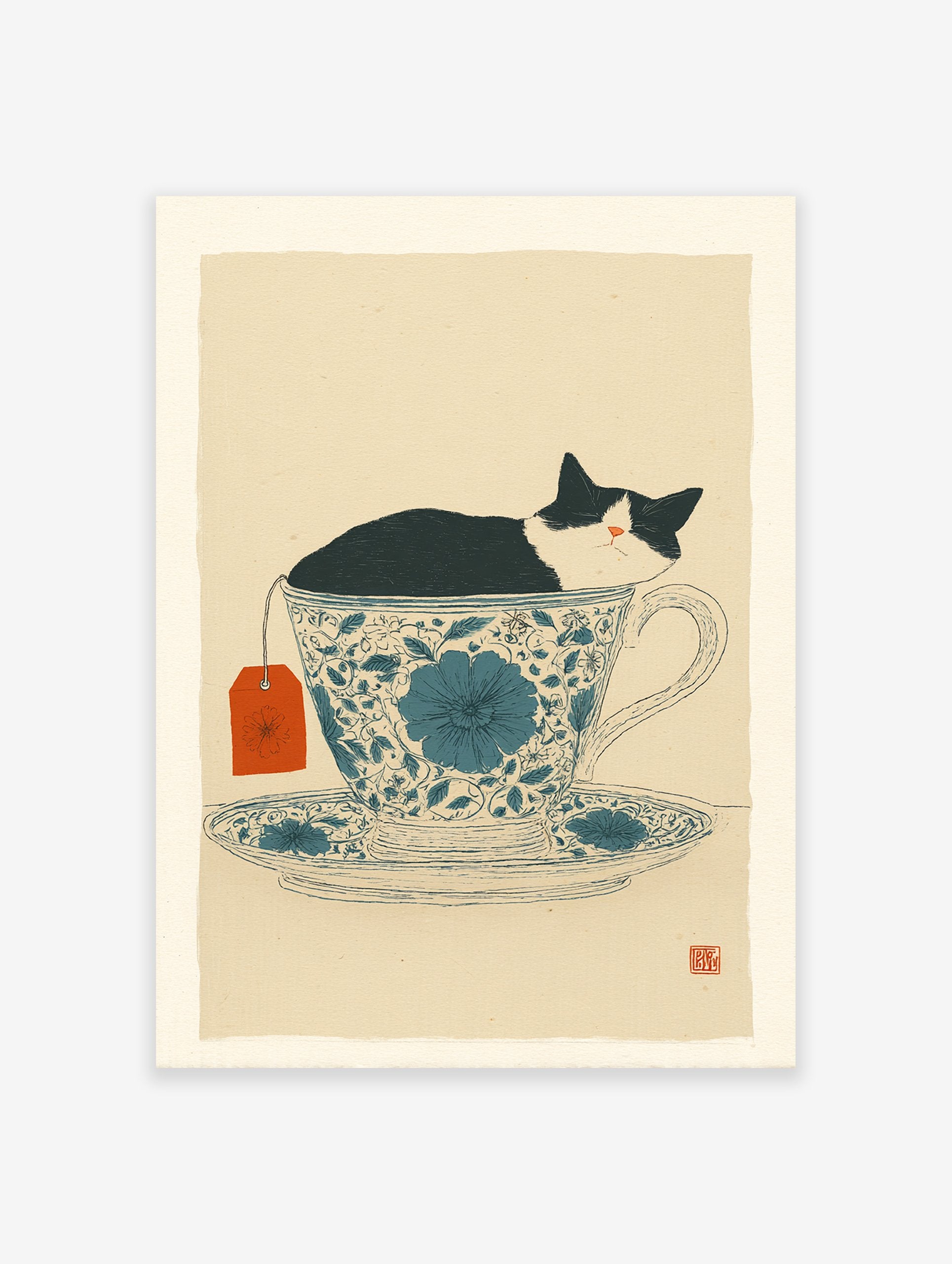 Black and white cat sleeping in a blue floral teacup with an orange tea tag, whimsical cat wall art print.