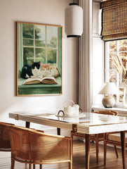 Painterly cat wall art showing a black and white cat and a ginger cat resting on an open book on a green window sill. - Image 2