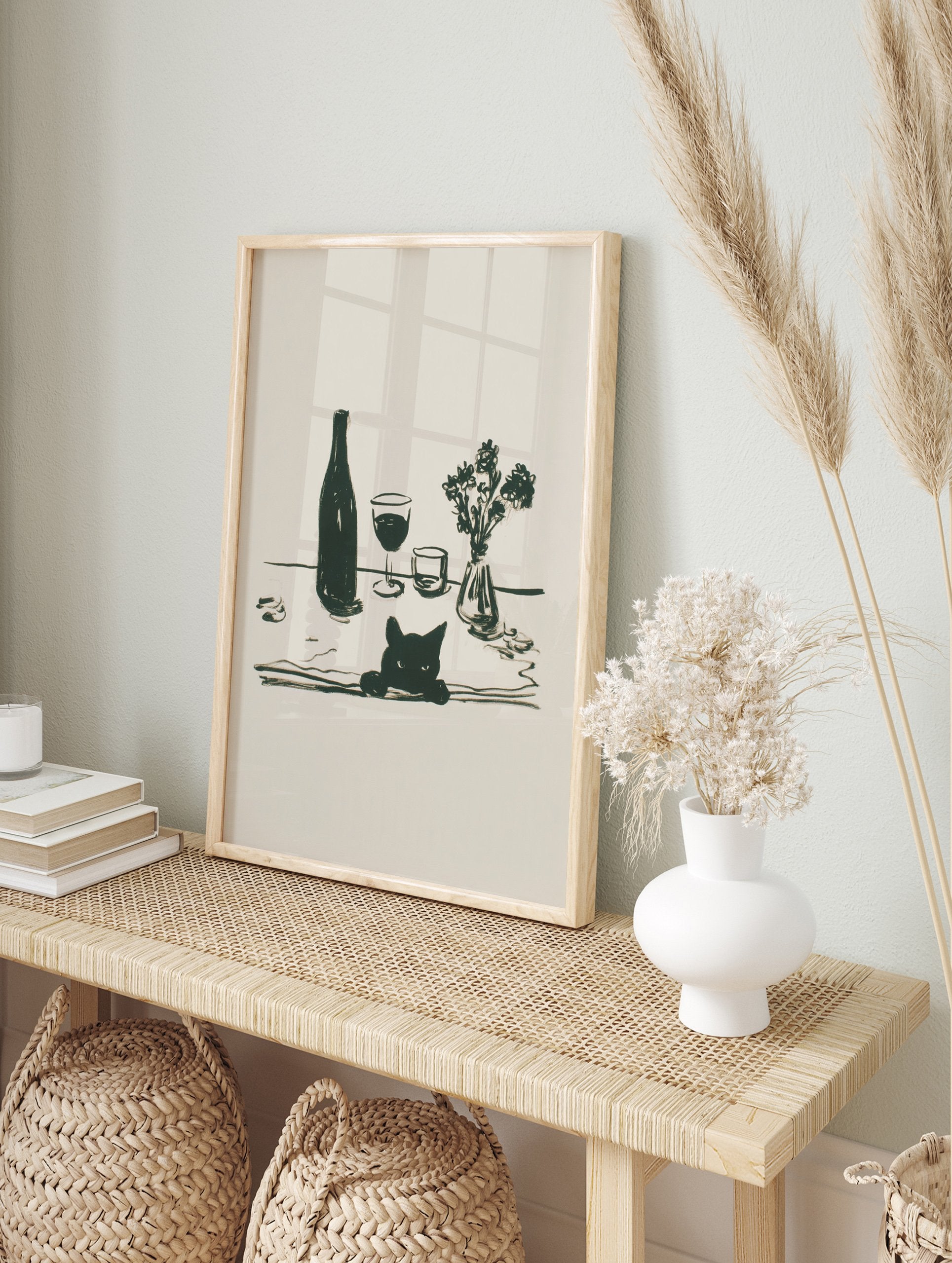 Minimalist black cat wall art illustration with a wine bottle, two glasses, and a small vase of flowers on a table. - Image 3