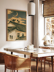 Two cats sitting on a traditional tiled roof under a crescent moon in an illustrative Japanese, in a styled room mockup