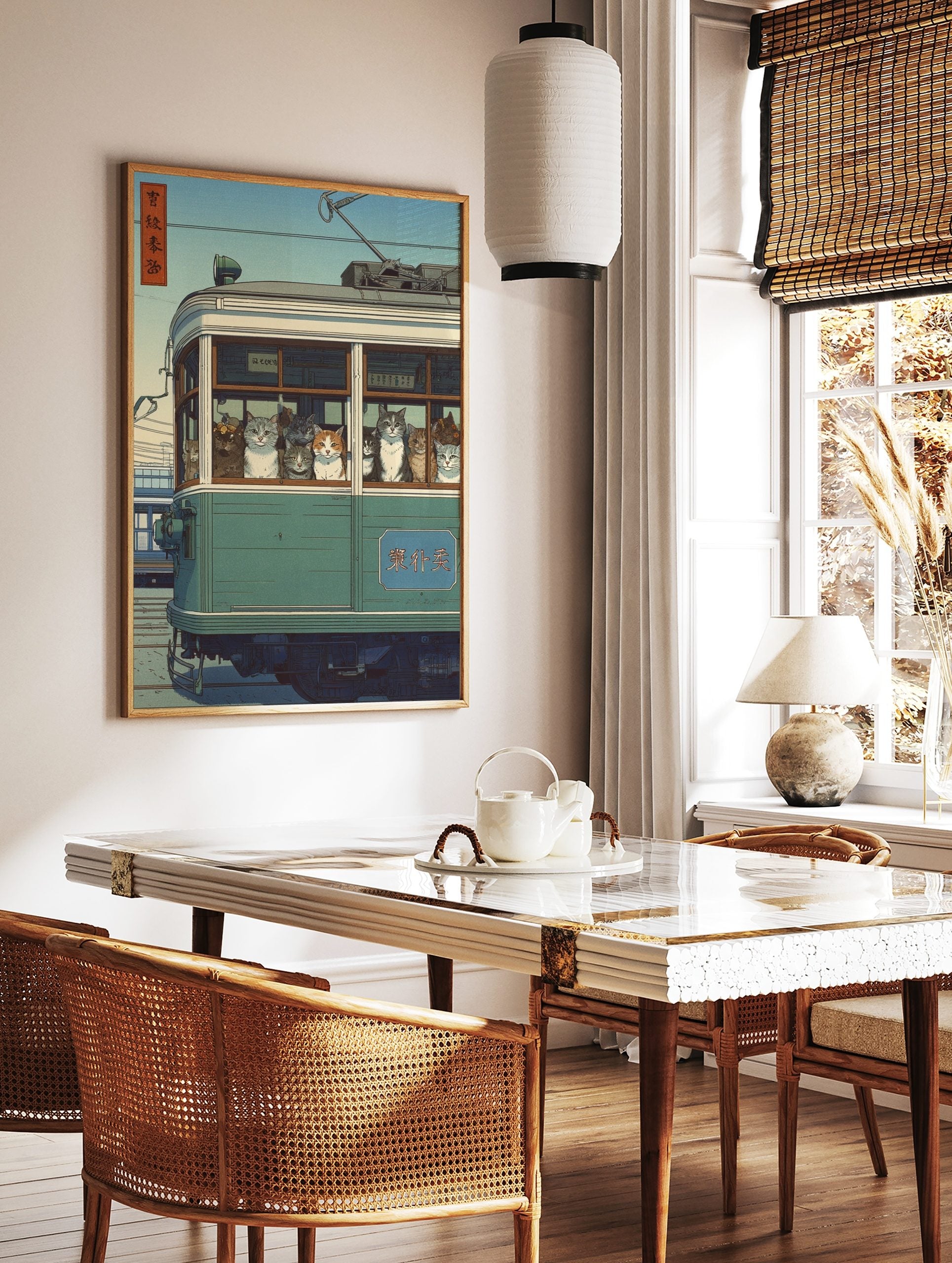 Japanese Ukiyo-e style print of many cats looking out from a green tram window under a blue sky, in a styled room mockup