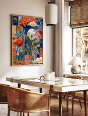 Collage art print with orange and pink flowers, full moon, green leaves, gold clouds, and blue/red, in a styled room mockup