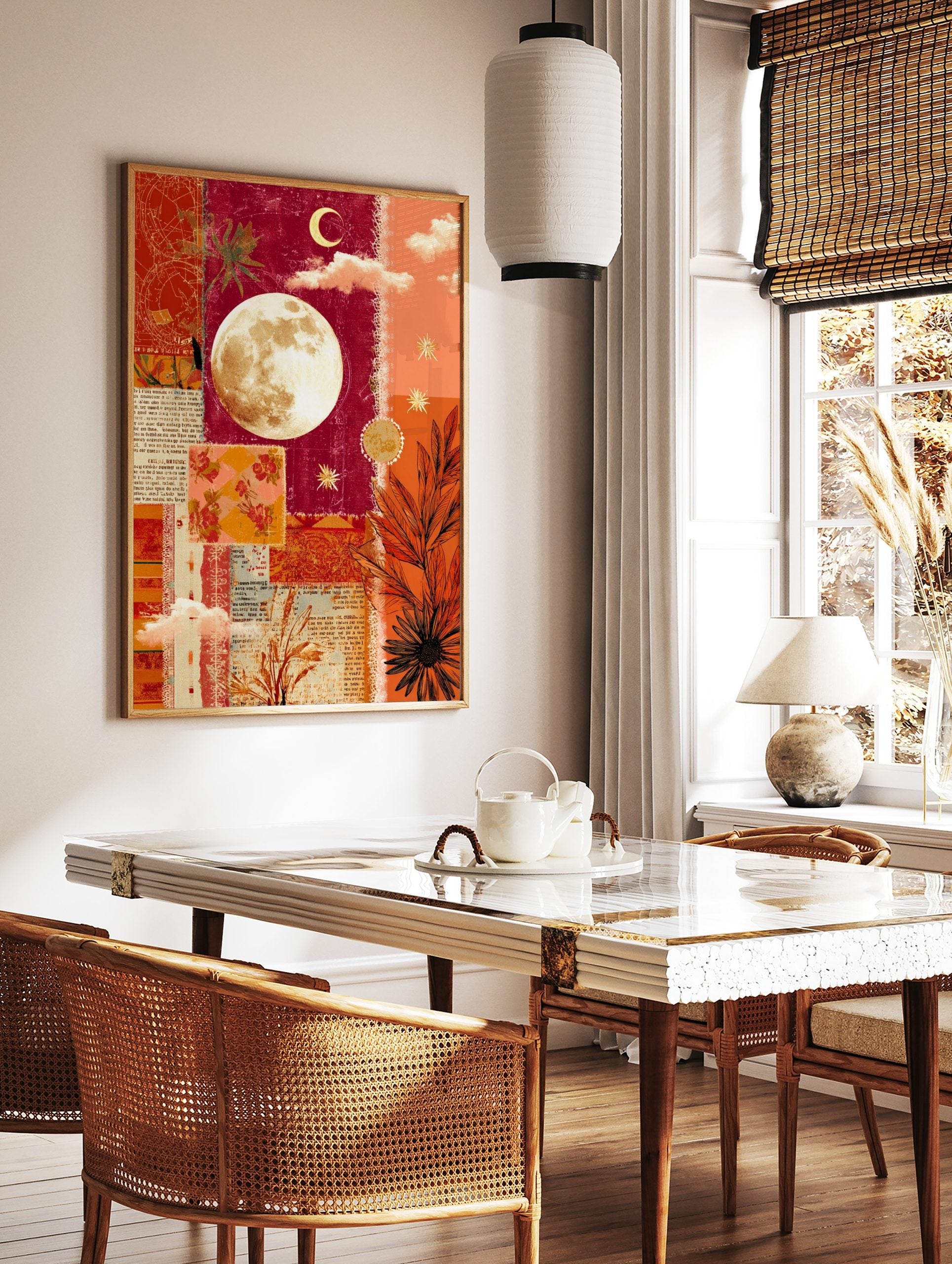 Mixed media collage wall art with a full moon, crescent, stars, and botanical elements in red and, in a styled room mockup