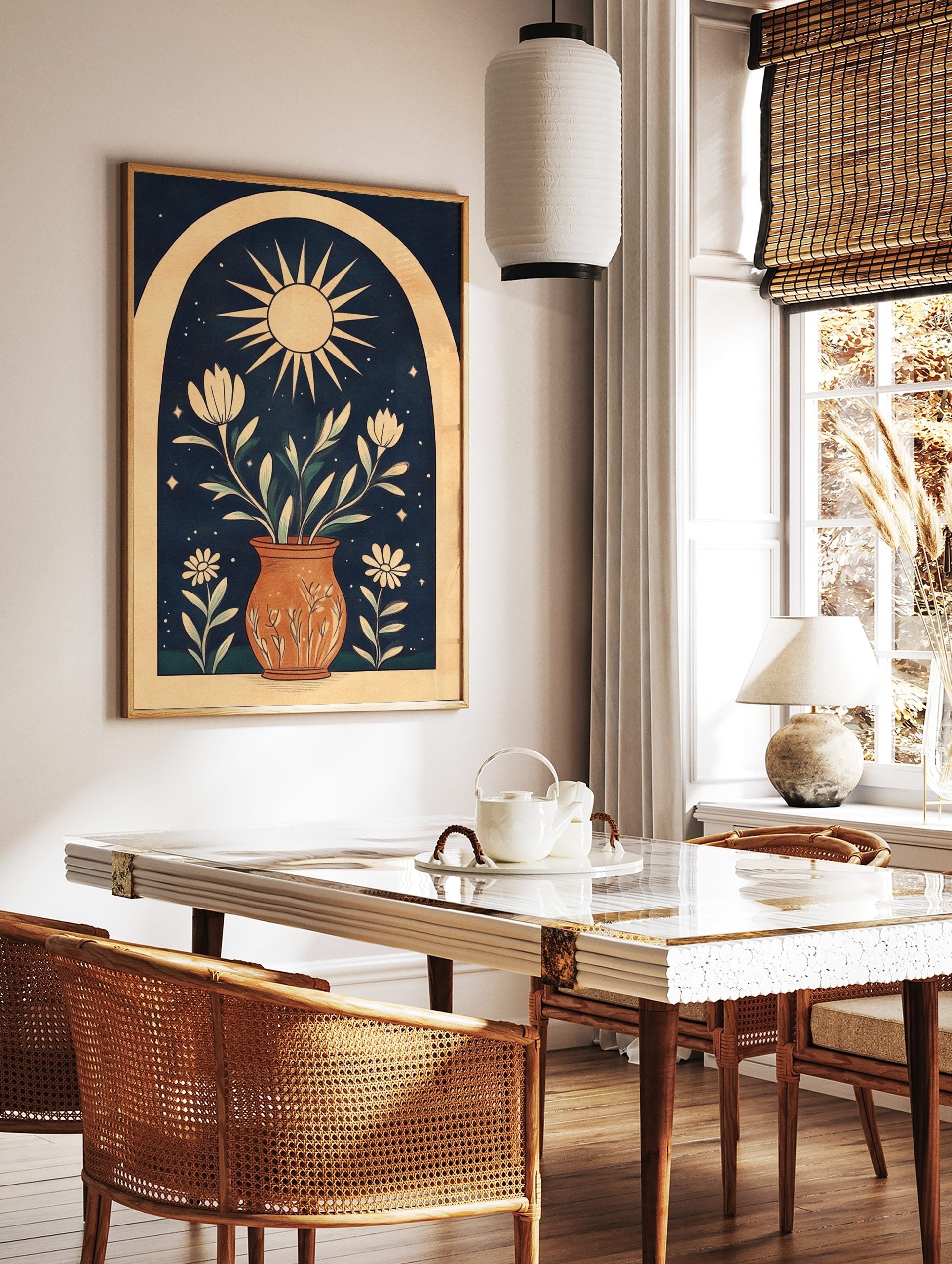 Illustrative wall art print with sun, potted white flowers, green leaves, stars, and arch on navy, in a styled room mockup