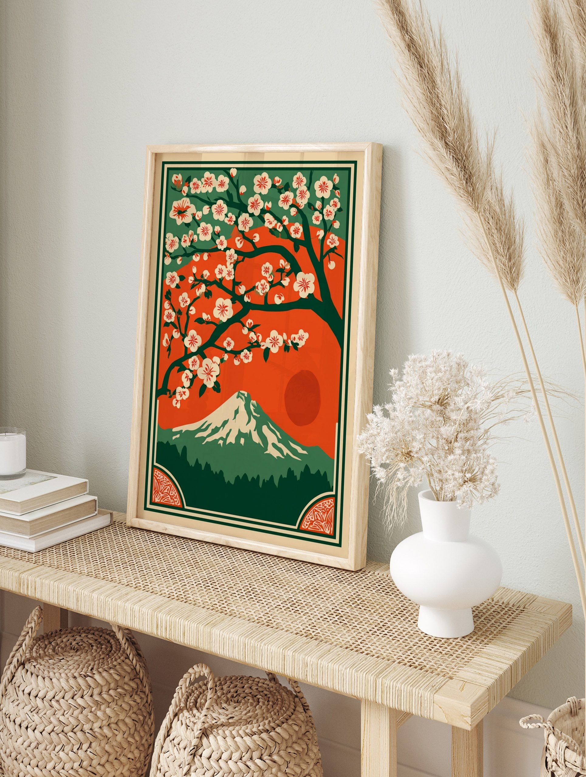 Japanese landscape art print with white cherry blossoms, Mount Fuji, red sun, and green forest, in an alternate framed mockup