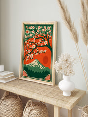 Japanese landscape art print with white cherry blossoms, Mount Fuji, red sun, and green forest, in an alternate framed mockup