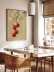 Japanese-style illustration of white cherry blossoms and red fruit on a tan background, in a styled room mockup
