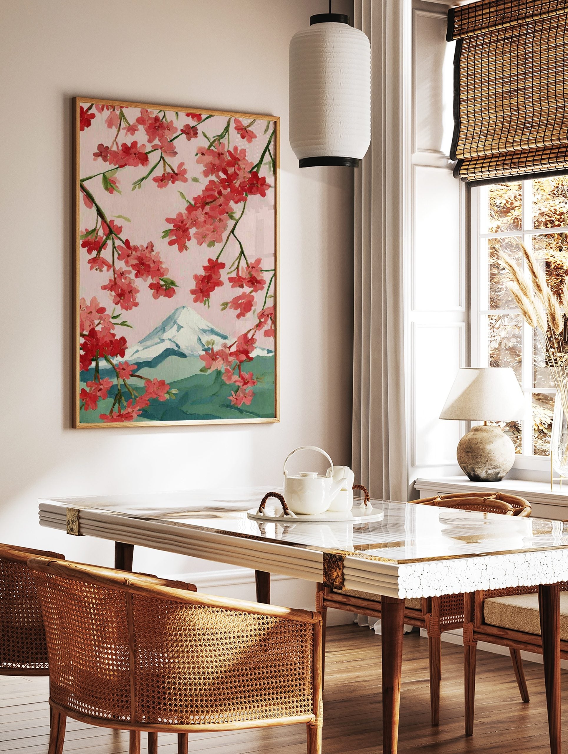 Illustrative cherry blossom branches with pink and red flowers framing snow-capped Mount Fuji, in a styled room mockup
