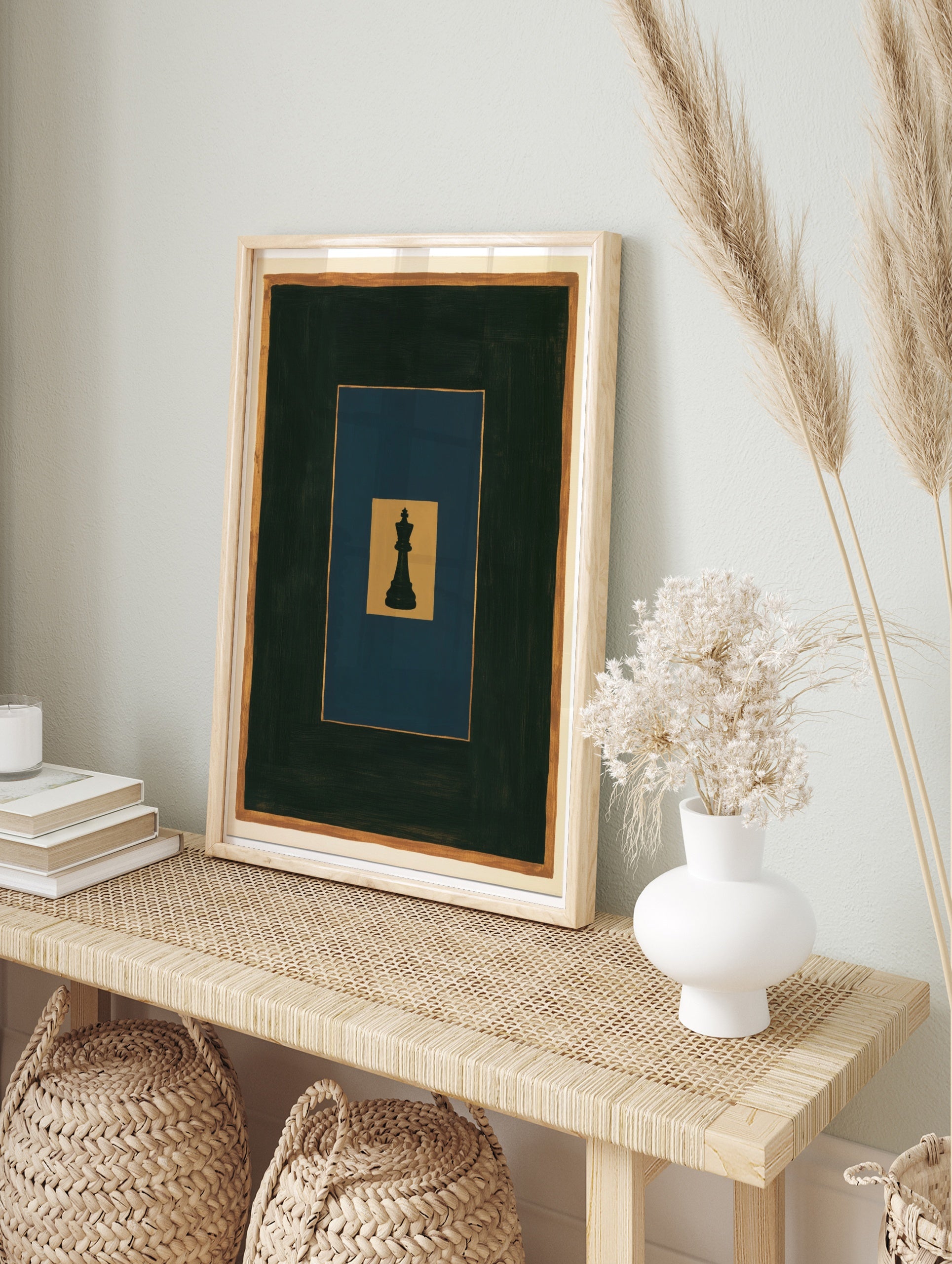 Minimalist black chess king piece on layered gold, blue, and dark grey rectangles, art print, in an alternate framed mockup
