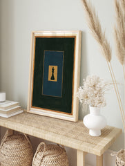 Minimalist black chess king piece on layered gold, blue, and dark grey rectangles, art print, in an alternate framed mockup
