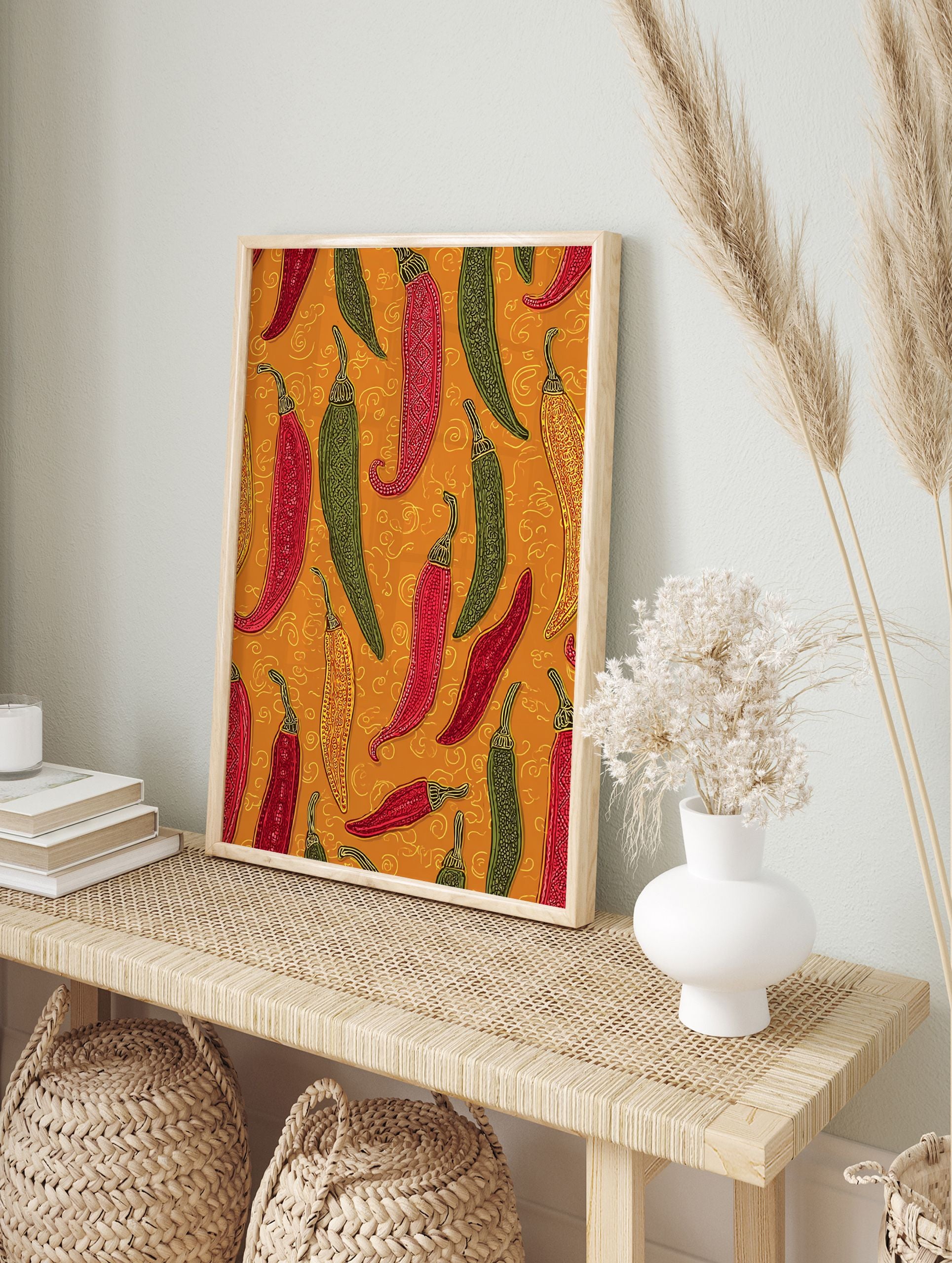 Colorful chili pepper wall art print featuring red, green, and yellow peppers with folk art patterns on an orange background. - Image 3
