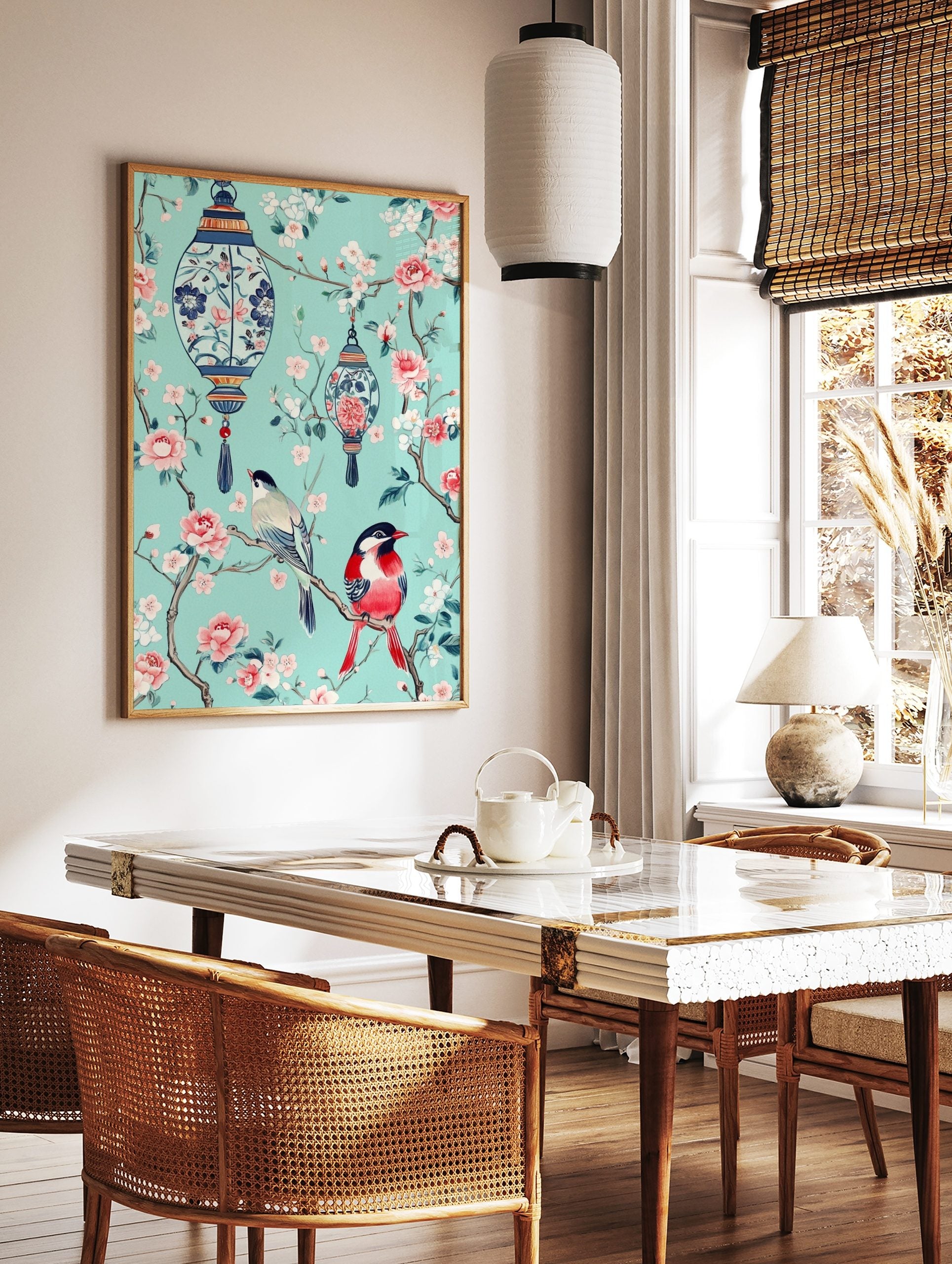 Chinoiserie art print with two colourful birds, pink blossoms, and blue lanterns on a teal, in a styled room mockup