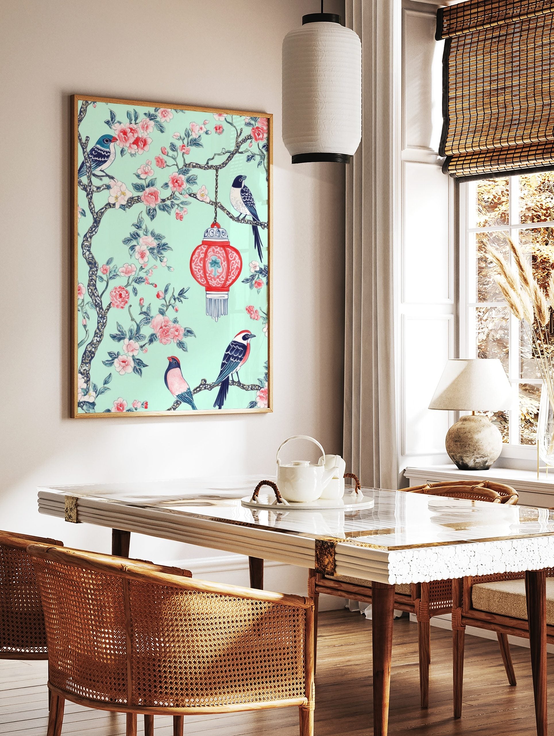 Chinoiserie wall art with three birds, pink flowers, and a red lantern on a mint green background, in a styled room mockup