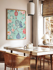 Chinoiserie foo dog on branch with pink peonies, green leaves, red and blue ornate lanterns on teal, in a styled room mockup
