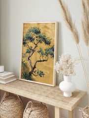 Chinoiserie tree illustration with green and blue leaves, gnarled trunk, on a golden-yellow, in an alternate framed mockup