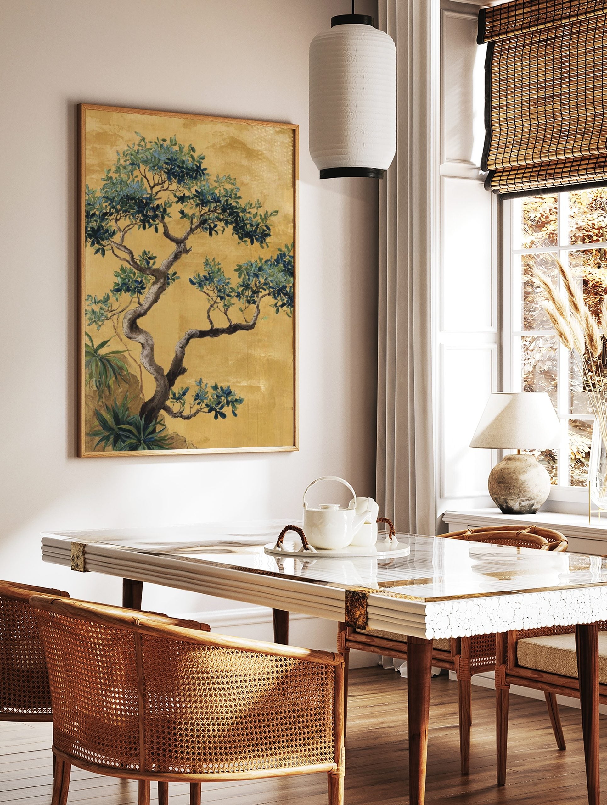 Chinoiserie tree illustration with green and blue leaves, gnarled trunk, on a golden-yellow, in a styled room mockup
