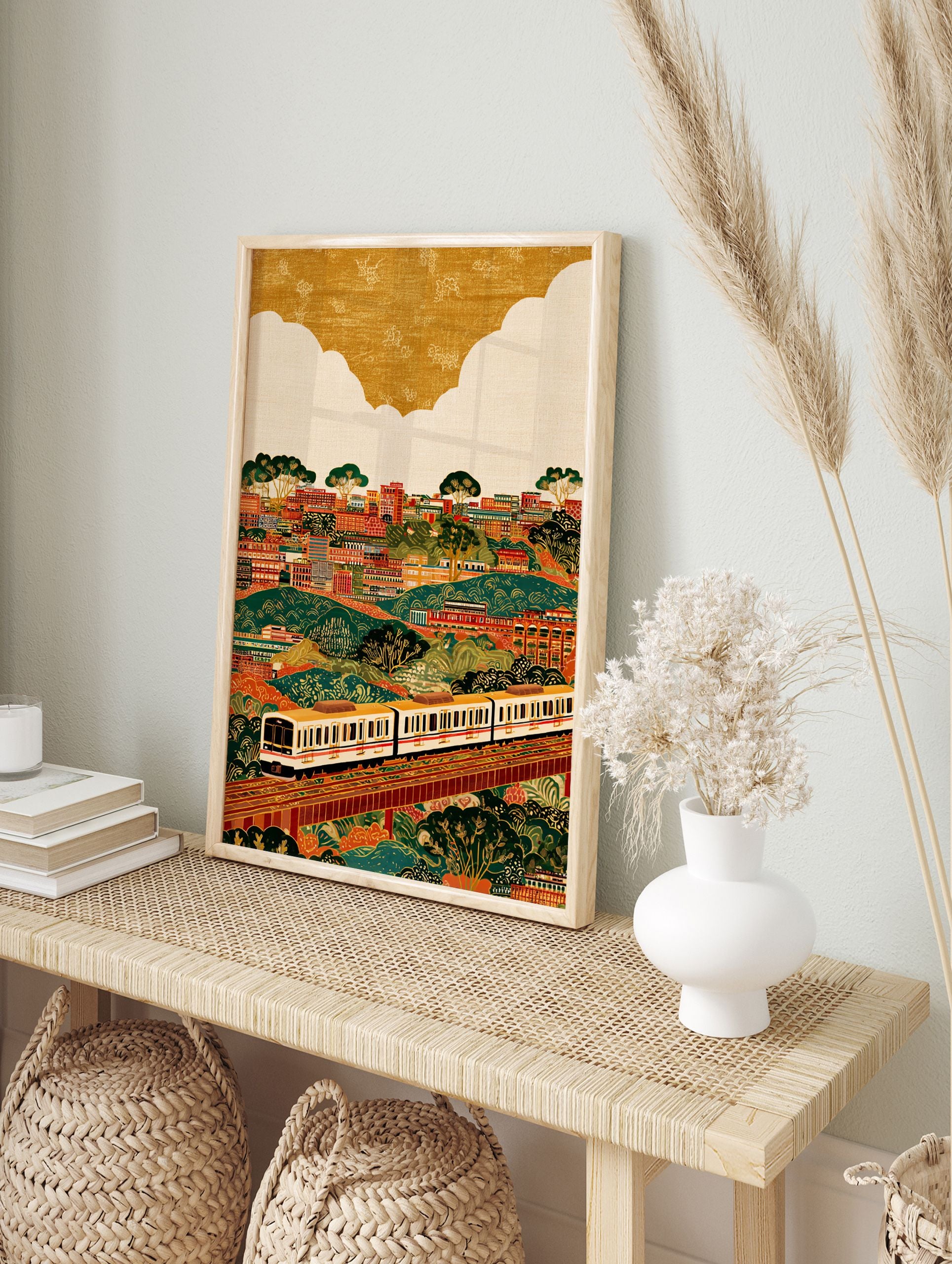 Vibrant cityscape train wall art illustration with buildings, green hills, trees, and a white train on elevated tracks. - Image 3