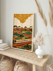 Vibrant cityscape train wall art illustration with buildings, green hills, trees, and a white train on elevated tracks. - Image 3