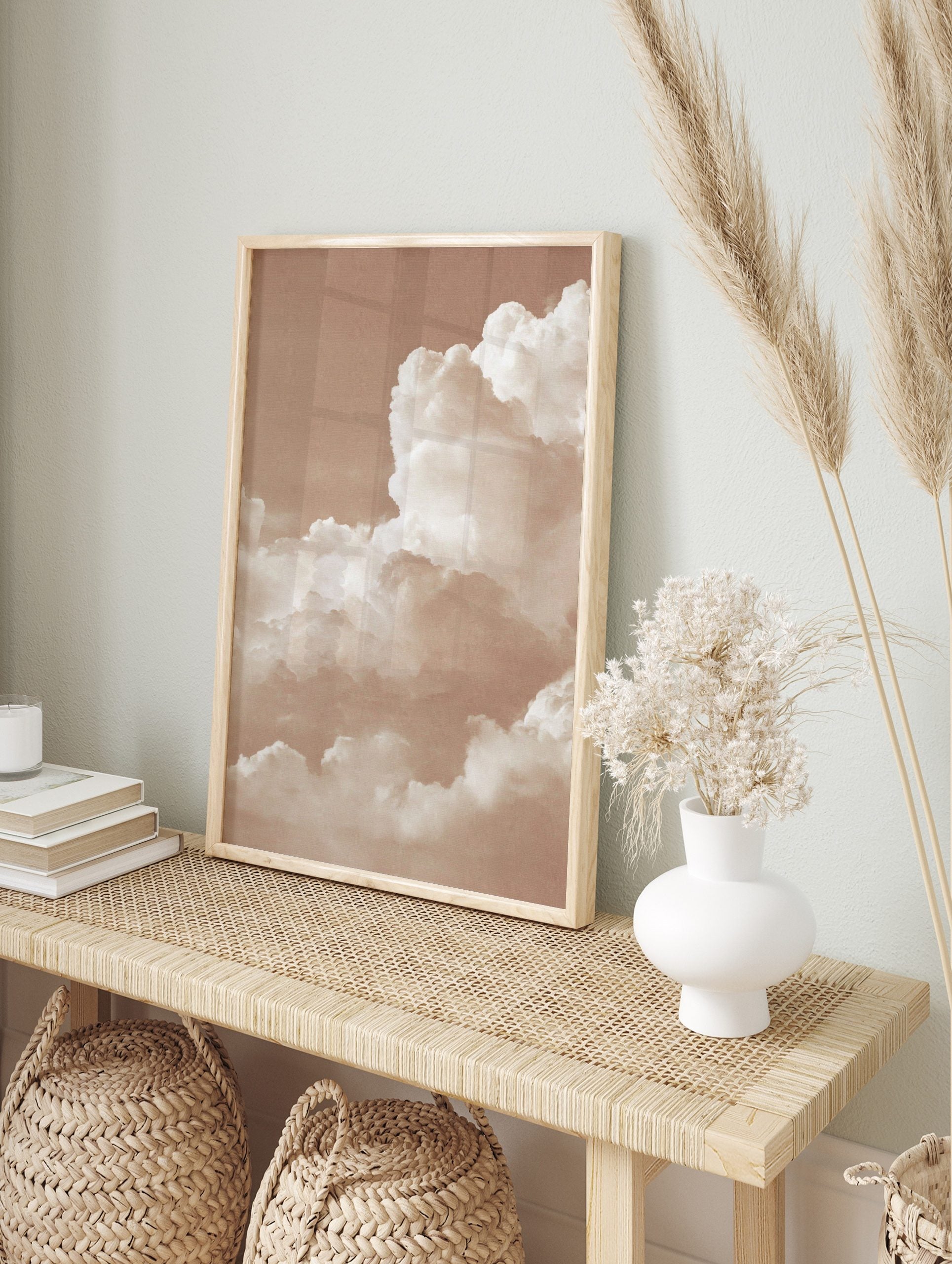 Sepia tone photo of fluffy cumulus clouds filling the sky, creating an abstract and peaceful, in an alternate framed mockup