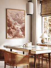 Aerial view of fluffy cumulus clouds in warm peach and white earth tones, filling the frame, in a styled room mockup