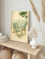 Illustrative coastal scene with striped deck chair, small table with coffee, and sea view, in an alternate framed mockup