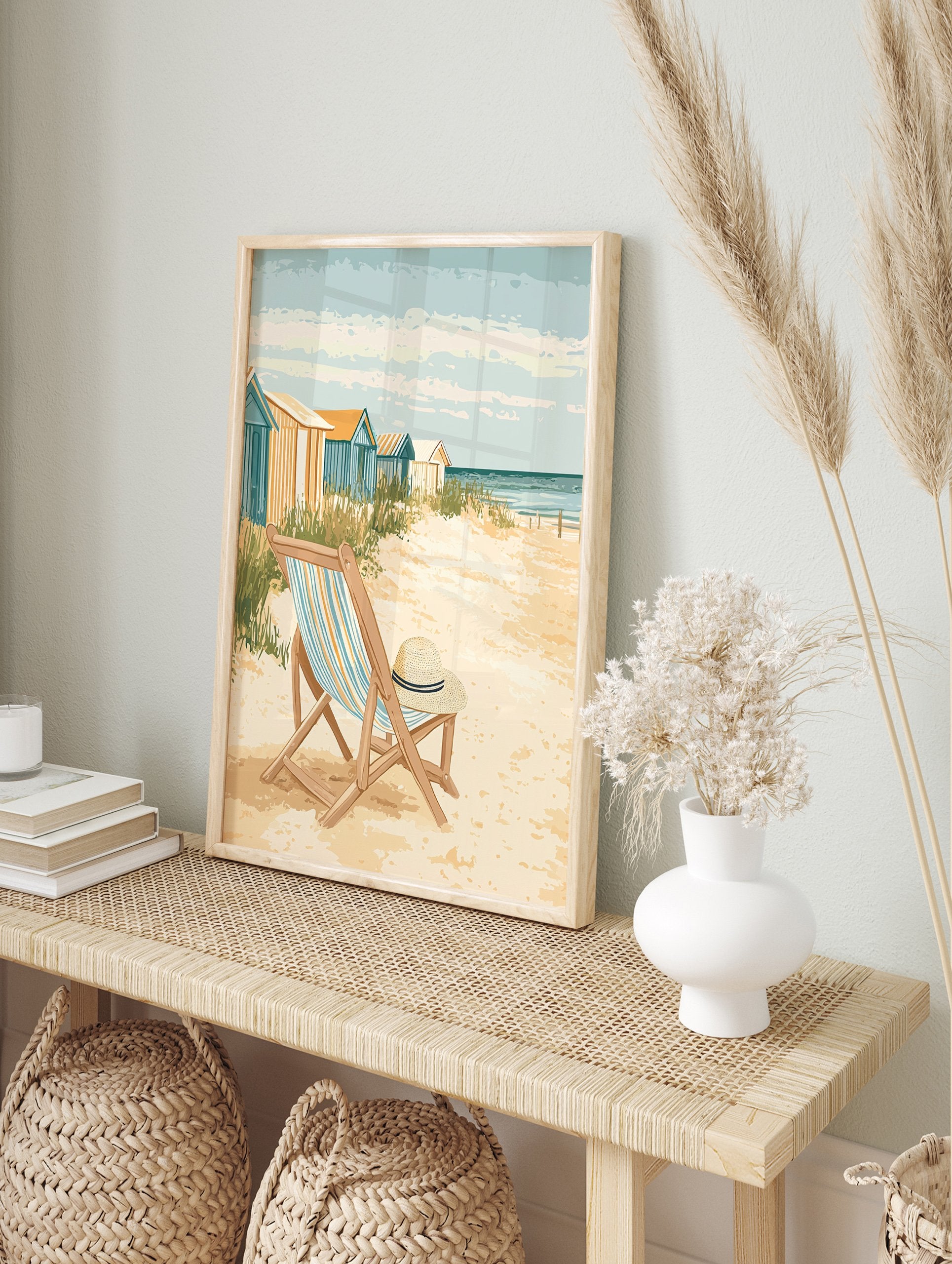 Coastal beach poster featuring a vintage illustration of beach huts, a striped deck chair with a straw hat, and the ocean. - Image 4